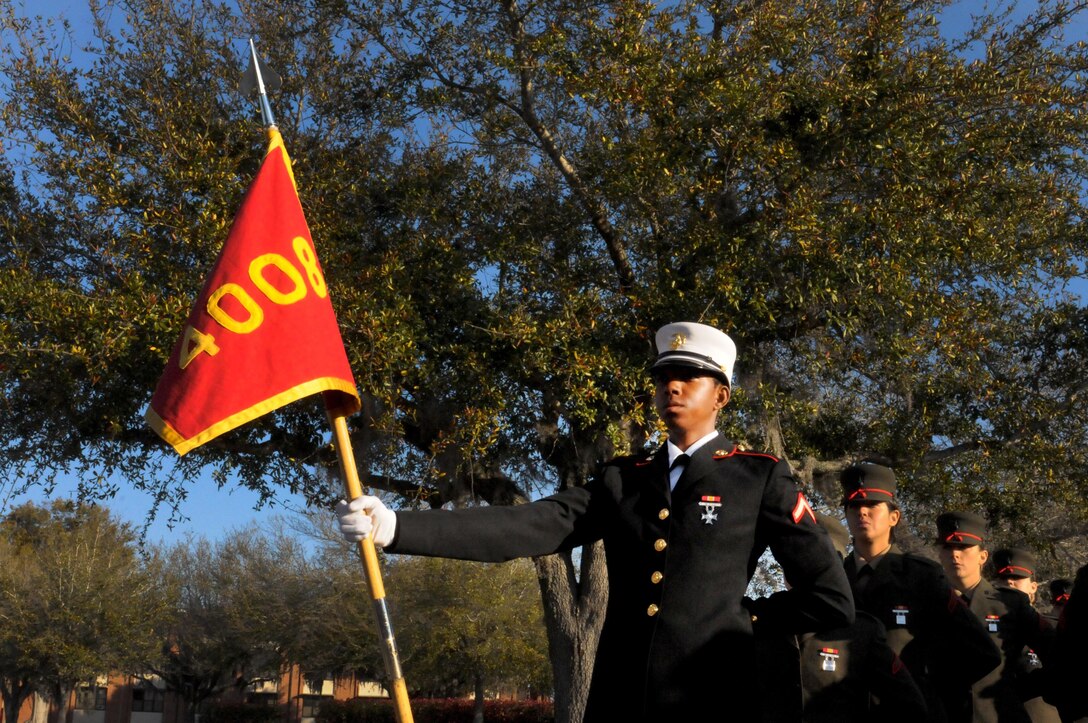 Private First Class Kheana Bell, honor graduate of platoon 4008, stands at parade rest before graduation aboard Parris Island, S.C., March 15, 2013. Bell, native of Birmingham, Ala., was recruited by Sgt Demetrius Bendolph out of RSS Vestavia Hills.  Bell will be able to enjoy some well deserved leave with her family after graduation. (U.S. Marine Corps photo by Cpl. Gabrielle Bustos)