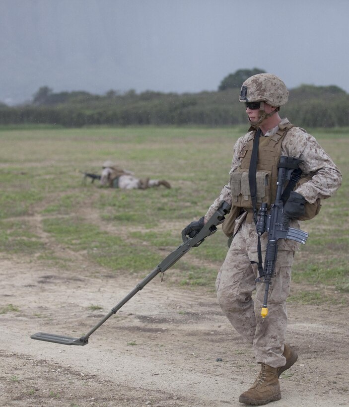 MARINE CORPS TRAINING AREA BELLOWS - Lance Cpl. Chad Weller, combat engineer with Combat Logistics Battalion 3, sweeps for mock explosives while on a security patrol cycle at Marine Corps Training Area Bellows, March 12, 2013. The training was to prepare the Marines for the first combat engineer training package at the Marine Corps Mountain Warfare Training Center in Bridgeport, Calif. The unit will arrive at Bridgeport in April where it will provide mobility and counter mobility support to 2nd Battalion, 3rd Marine Regiment, which will undergo its own training package. (U.S. Marine Corps photo by Lance Cpl. Jacob D. Barber)
