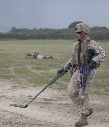 MARINE CORPS TRAINING AREA BELLOWS - Lance Cpl. Chad Weller, combat engineer with Combat Logistics Battalion 3, sweeps for mock explosives while on a security patrol cycle at Marine Corps Training Area Bellows, March 12, 2013. The training was to prepare the Marines for the first combat engineer training package at the Marine Corps Mountain Warfare Training Center in Bridgeport, Calif. The unit will arrive at Bridgeport in April where it will provide mobility and counter mobility support to 2nd Battalion, 3rd Marine Regiment, which will undergo its own training package. (U.S. Marine Corps photo by Lance Cpl. Jacob D. Barber)