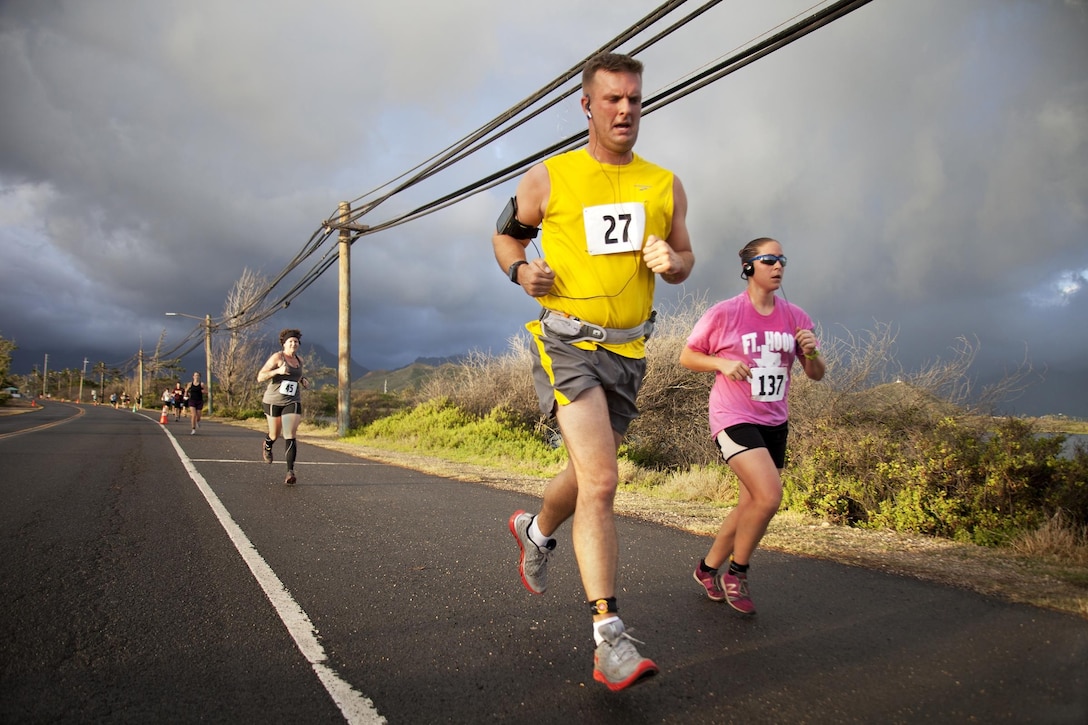 MARINE CORPS BASE HAWAII - Participants run by the Nuupia Ponds on Mokapu Rd. on Marine Corps Base Hawaii during “The Beast” 10-kilometer race, March 9.(U.S. Marine Corps photo by Lance Cpl. Nathan Knapke)