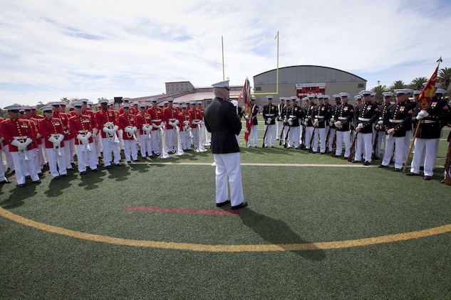 Lt. Gen. John A. Toolan, center, thanks the Marines from the Battle Color Detachment for their performance after the Battle Color Ceremony at the Paige Fieldhouse Football Field here March 15. Toolan is the commanding general for the 1st Marine Expeditionary Force here.