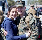 Marines and sailors with Black Sea Rotational Force 13 deployed from Marine Corps Base Camp Lejeune, N.C., to Eastern Europe today for a six-month tour. Lance Cpl. Michael Dye and his wife embrace one more time before getting on the bus to depart.