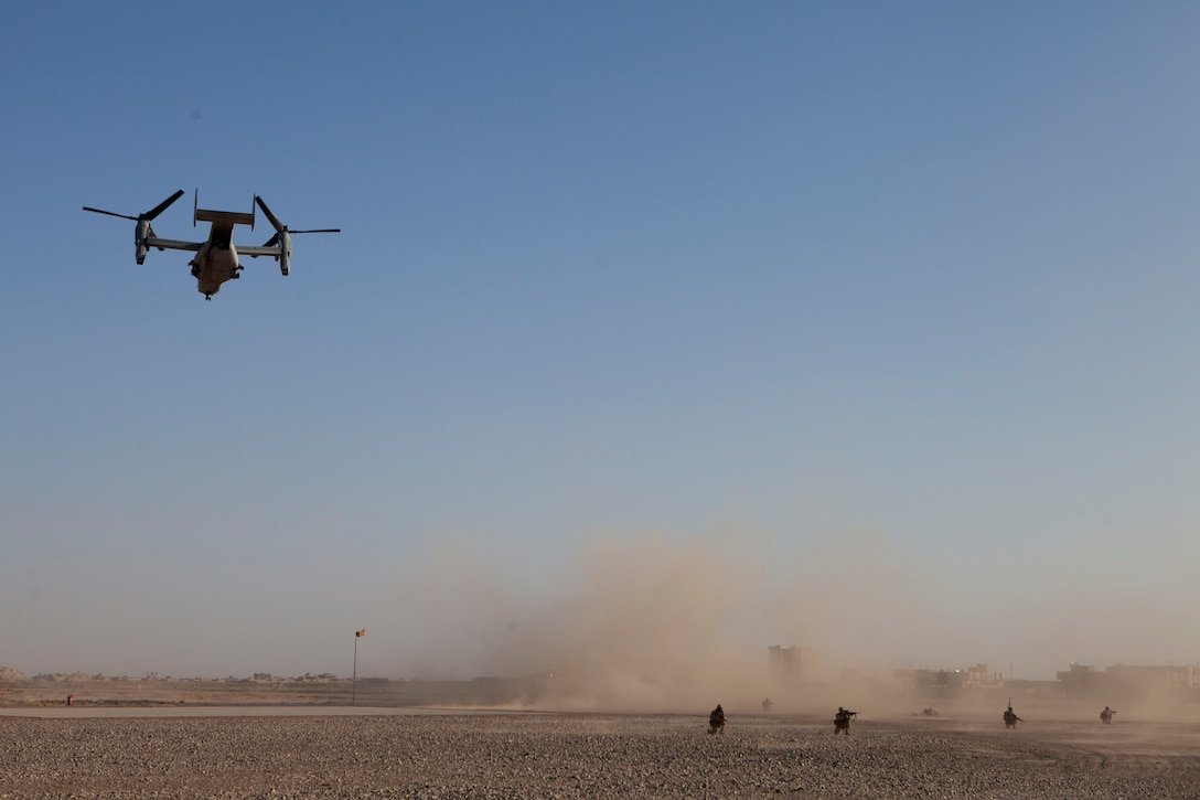 U.S. Marines with 2nd Battalion, 7th Marine Regiment (2/7), secure a landing zone while an MV-22 Osprey departs prior to a key leader engagement in Nimroz Province, Afghanistan, March 13, 2013. Maj. Gen. Walter L. Miller, commanding general of Regional Command (Southwest) and other key personnel visited Mohammad Sarwar Subat, Nimroz provincial governor, in order to discuss local topics such as integrated coalition training, women's rights, and budget issues. (Official Marine Corps Photo by Sgt. Tammy K. Hineline/Released)