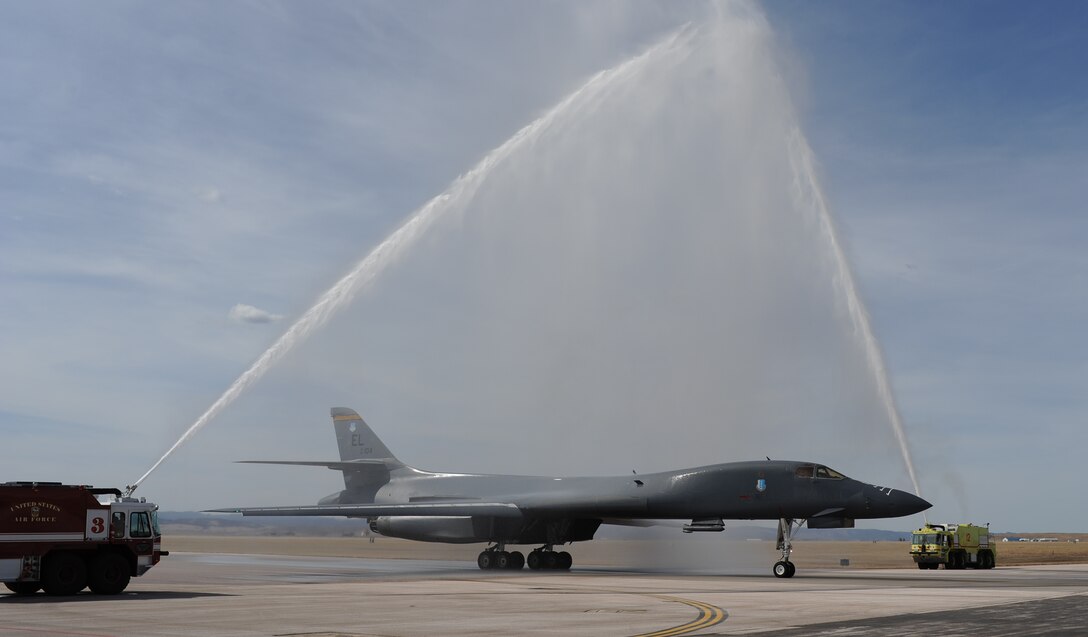 Col. Mark Weatherington, 28th Bomb Wing commander, taxies a B-1through a water arch near the conclusion of his end of tour flight at Ellsworth Air Force Base, S.D., March 14, 2013. Weatherington, who has served as the 28th BW commander since May 13, 2011, will move to the Pentagon to serve as the military assistant to the Deputy Secretary of Defense, Ashton Carter. (U.S. Air Force photo by Master Sgt. John Barton/Released)