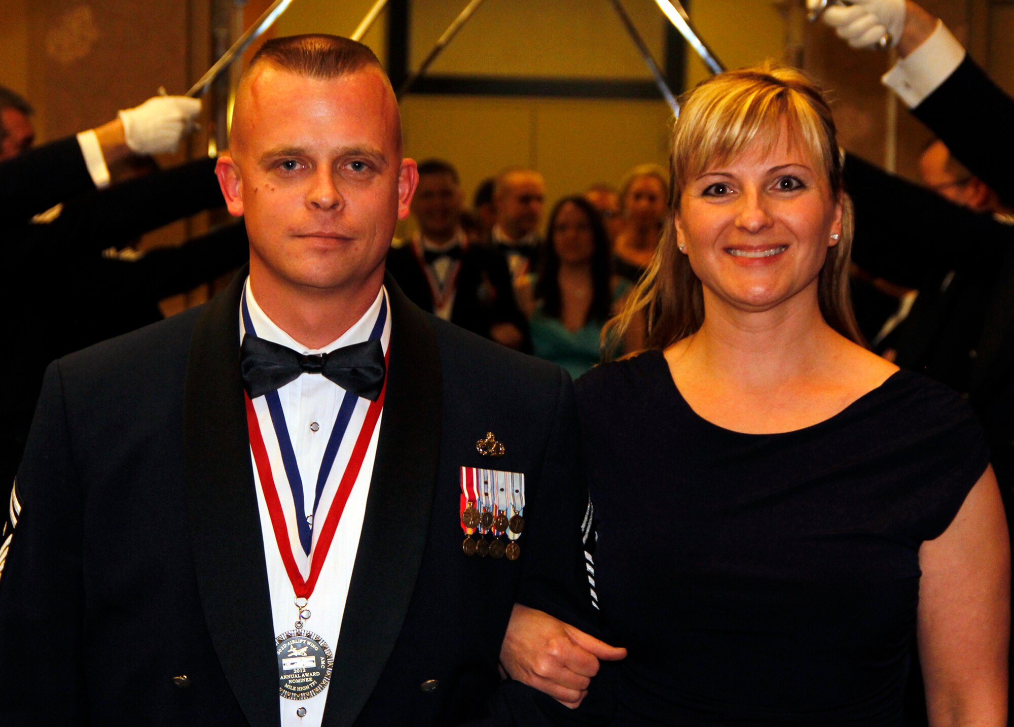Senior Master Sgt. Daniel Anthony, 302nd Maintenance Squadron first sergeant, is accompanied by wife Patty during the introduction of the nominees at the 302nd Airlift Wing’s Annual Awards Banquet March 2 at the Crowne Plaza hotel, Colorado Springs, Colo. Anthony was honored as the 302nd AW’s 2012 First Sergeant of the Year. He also earned the 22nd Air Force 2012 First Sergeant of the Year Award. (U.S. Air Force photo/Staff Sgt. Nathan Federico)