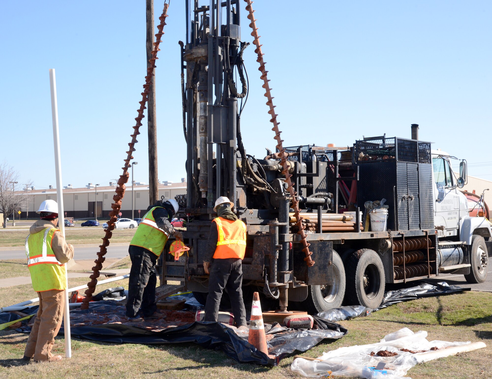 A water quality monitoring well was drilled Monday near the Burger King at Arnold and M Ave. Groundwater samples pumped from the well will be analyzed periodically for evidence of pollution, said Jason Flaming, an environmental engineer with the 72nd Air Base Wing Civil Engineering Directorate. Previously a laundry facility was operated west of the restaurant site, Mr. Flaming related. In addition, he said, a gasoline station was located north of the eatery site, but fuel contamination from that former facility has already been extracted. The monitoring well was drilled by a subcontractor under a Performance-Based Remediation Contract through the Air Force Civil Engineer Center. (Air Force photo by Kelly White)
