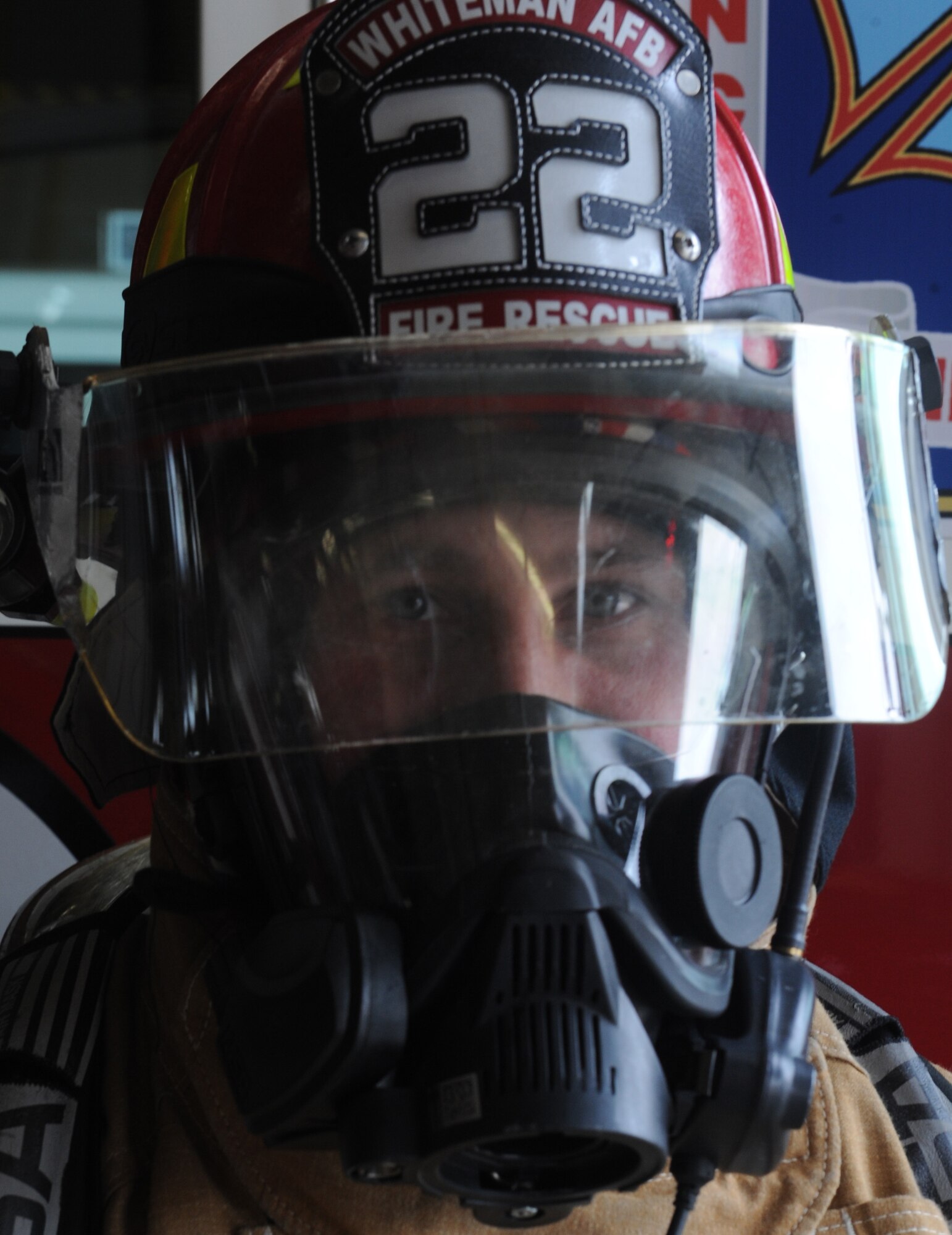 WHITEMAN AIR FORCE BASE, Mo. -- Tech. Sgt. Corey McGee, 509th Civil Engineer Squadron Fire Emergency Services, suits up in his full fire suit, March 9. McGee’s original goal was to be firefighter, a dream he gets to realize every day. (U.S. Air Force photo/Airman 1st Class Bryan Crane)(Released)
