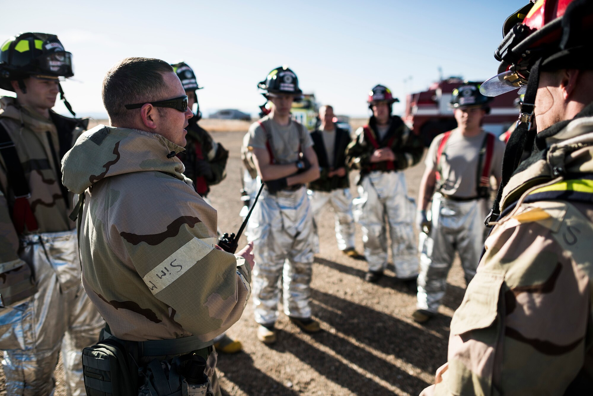 MOUNTAIN HOME AIR FORCE BASE, Idaho -- Firefighters from the 366th Civil Engineer Squadron discuss a live fire training exercise during a base-wide operational readiness exercise March 4, 2013, at Mountain Home Air Force Base, Idaho. The firefighters discussed how well they did during the exercise and ways to improve the effectiveness of their response. (U.S. Air Force photo/Tech. Sgt. Samuel Morse)