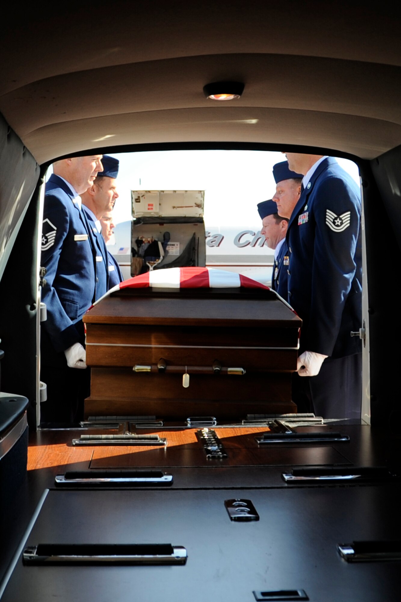 An honor guard consisting of friends and co-workers of Tech. Sgt. Larry Bunn place him in a hearse at Barksdale Air Force Base, La., March 15, 2013. Bunn, an Air Reserve Technician assigned to the 307th Maintenance Squadron returned home to his family. Sergeant Bunn died March 7, 2013, while deployed in support of Operation Enduring Freedom. He had been deployed to an undisclosed location in Southwest Asia since Sep 2012, and was due to return home later this month. (U.S. Air Force photo by Master Sgt. Jeff Walston)