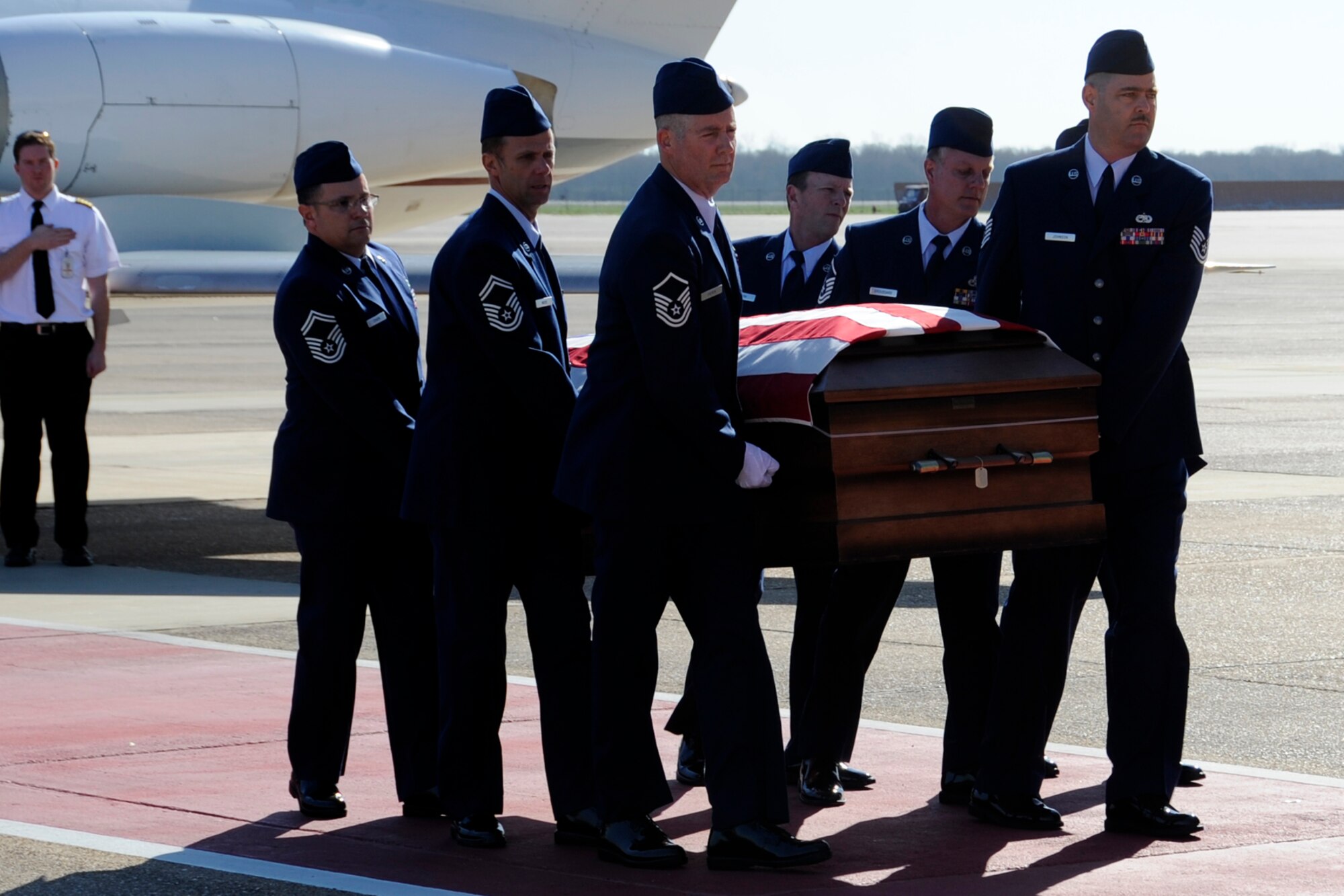 An honor guard consisting of friends and co-workers of Tech. Sgt. Larry Bunn carry him to a waiting hearse at Barksdale Air Force Base, La., March 15, 2013. Bunn, an Air Reserve Technician assigned to the 307th Maintenance Squadron returned home to his family.  Sergeant Bunn died March 7, 2013, while deployed in support of Operation Enduring Freedom. He had been deployed to an undisclosed location in Southwest Asia since Sep 2012, and was due to return home later this month. (U.S. Air Force photo by Master Sgt. Jeff Walston)