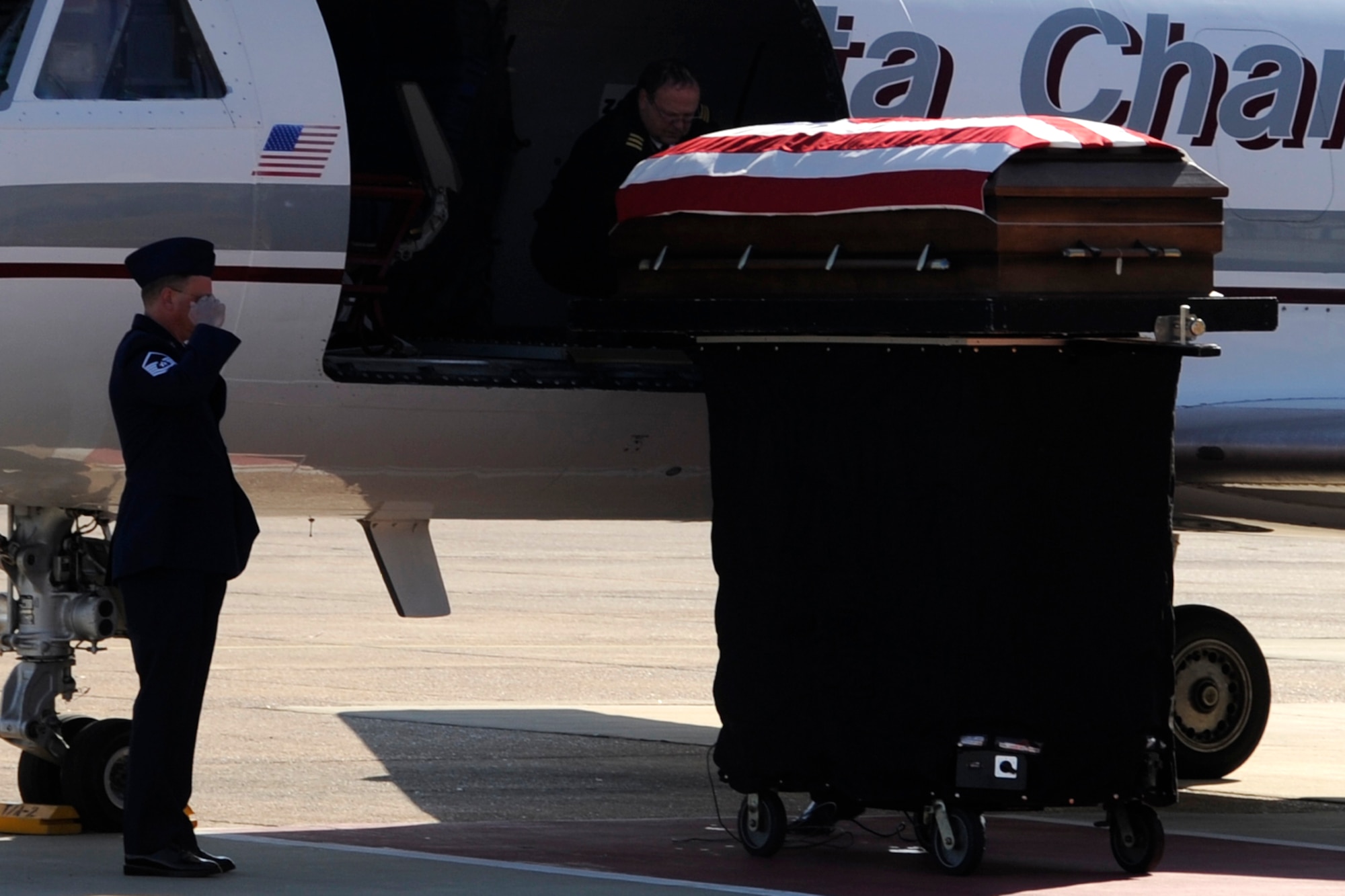 Master Sgt. Roger Suiter, who was the escort for Tech. Sgt. Larry Bunn’s return to Barksdale renders a last salute, March 15, 2013. Bunn, an Air Reserve Technician assigned to the 307th Maintenance Squadron returned home to his family.  Sergeant Bunn died March 7, 2013, while deployed in support of Operation Enduring Freedom. He had been deployed to an undisclosed location in Southwest Asia since Sep 2012, and was due to return home later this month. (U.S. Air Force photo by Master Sgt. Jeff Walston)