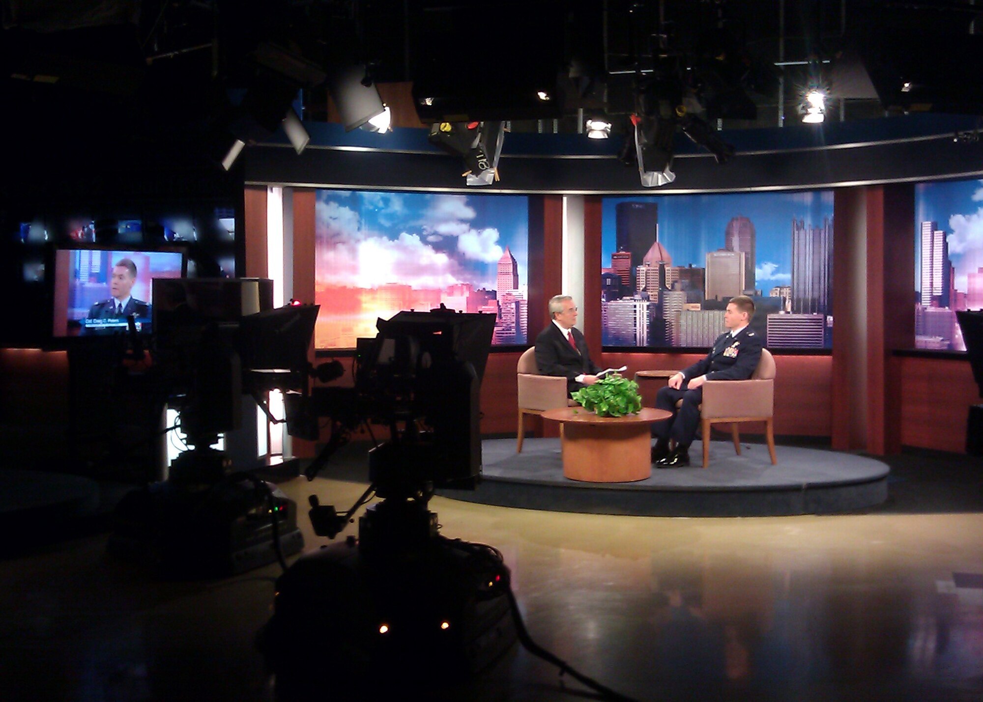 Host of KDKA’s Sunday Business Page, Jon Delano, interviews Col. Craig C. Peters, 911th Airlift Wing commander during a prerecorded taping, March 14, 2013, about the future of the Pittsburgh Air Reserve Base. This edition of the Sunday Business Page will air, March 17 at 6:30 a.m.  Some information discussed was the recent announcement concerning the Intra-theater Working Group’s decision to restore the Air Reserve Station’s eight aircraft and associated personnel through fiscal year 2014. (Courtesy Photo)