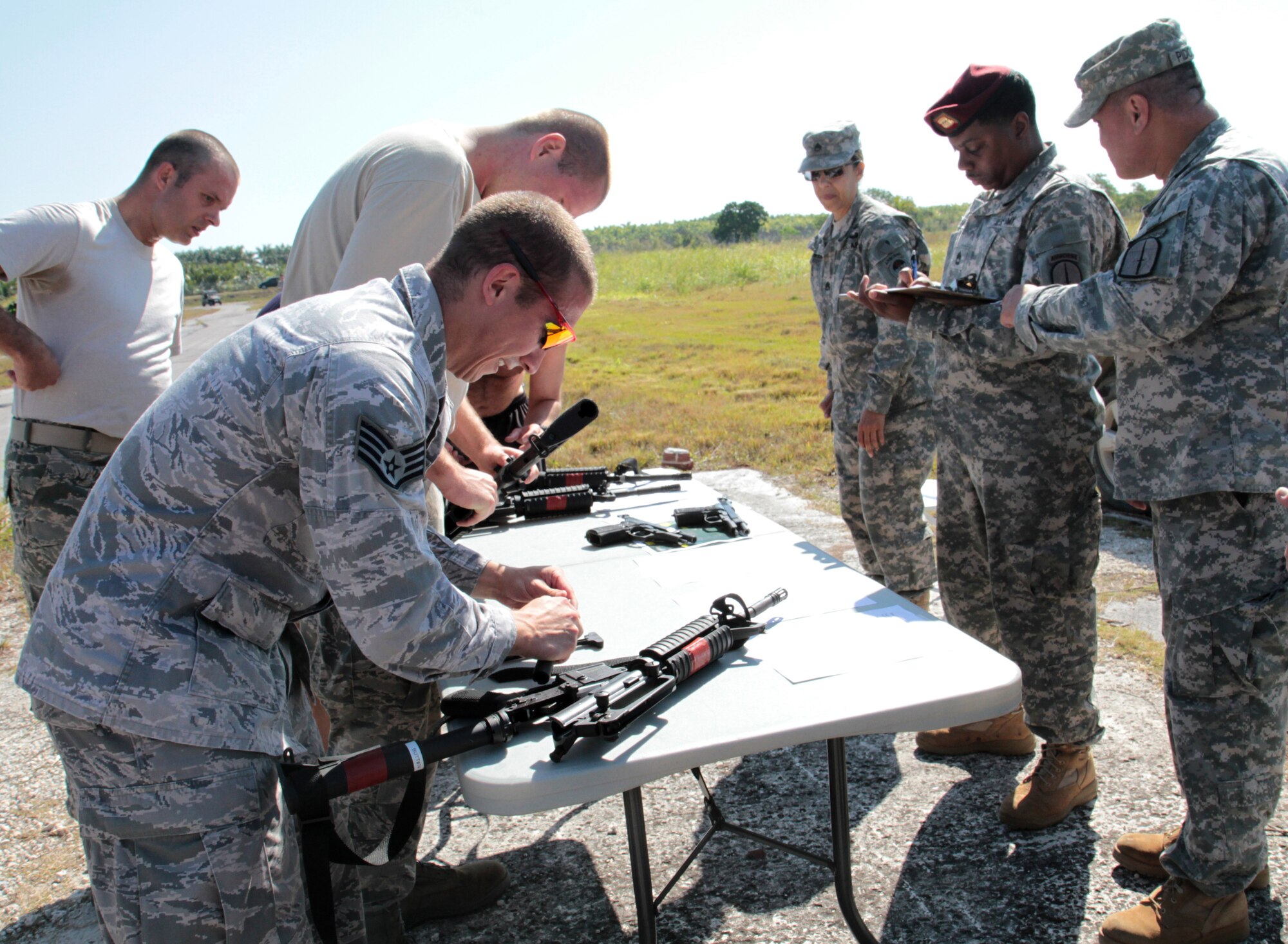 Members of Special Operations Command South assemble M-4 rifles during the SOCSOUTH Warrior Challenge at Homestead Air Reserve Base, Fla., March 8. The challenge featured several physical fitness and military skills events such as a 4.5 mile run, weapons malfunction and assembly station, and 4.5 mile ruck march. The event consisted of 21 teams assigned to SOCSOUTH competing for bragging rights among the unit. The competition allowed for members of the command to enjoy a day of fun and help build its esprit de corps. The event ended with a command barbeque. (DOD photo by Army Sgt. 1st Class Alex Licea, SOCSOUTH Public Affairs)   