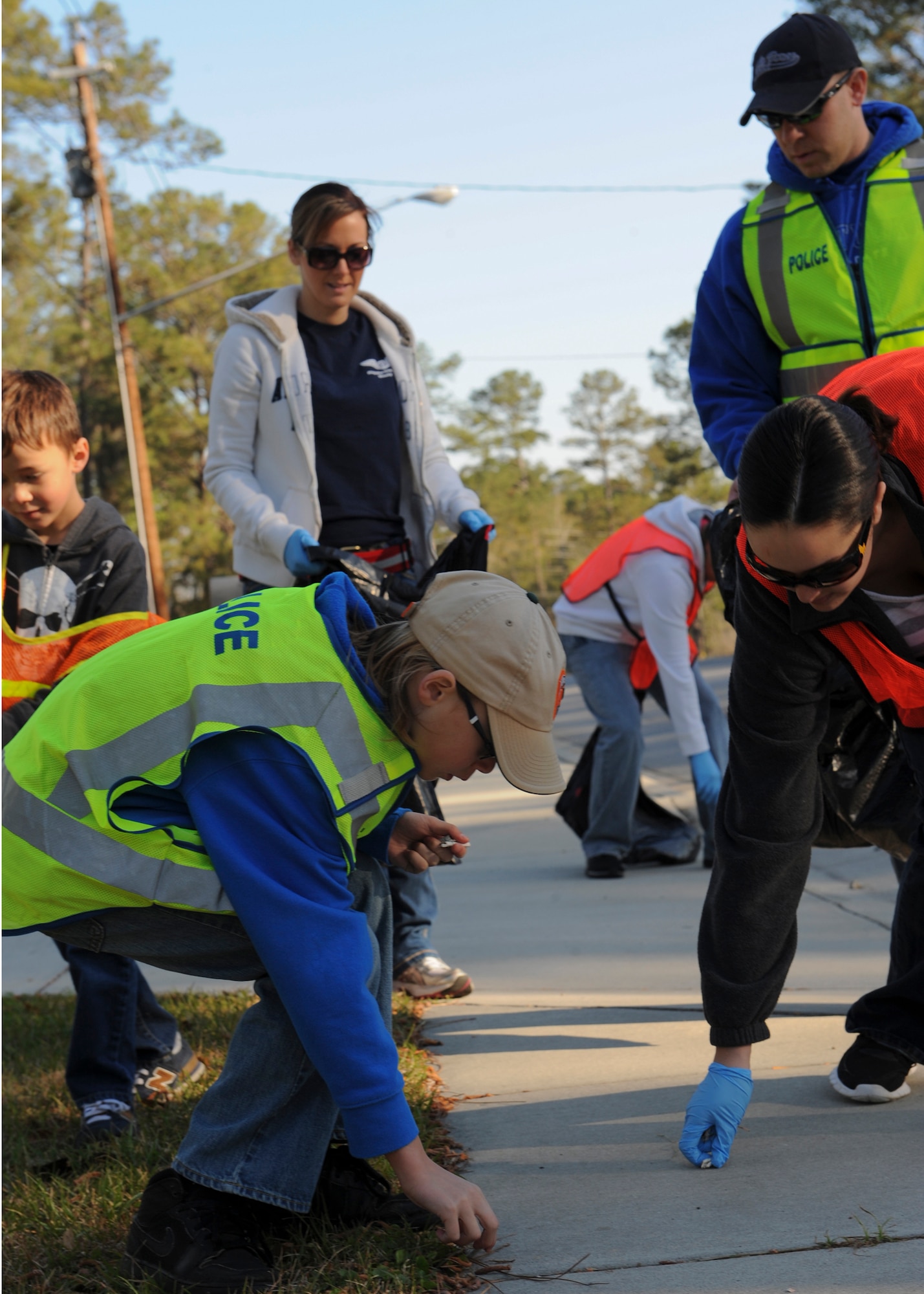 Members of the Moody Air Force Base Air Force Sergeants Association Chapter 460 and their families pick up trash on Gornto Road for the Adopt-A-Road program in Valdosta, Ga., March 9, 2013. Volunteer events contributing to the local community such as the Adopt-A-Road program fosters the relationship with the Air Force and local citizens. (U.S. Air Force photo by Senior Airman Eileen Meier/Released)