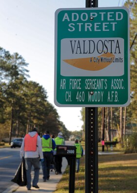 Members of the Moody Air Force Base Air Force Sergeants Association (AFSA) Chapter 460 pass by an ‘adopted street’ sign on Gornto Road in Valdosta, Ga., March 9, 2013. A clean-up crew with the AFSA group will make trips to the adopted road once a month to ensure it is kept litter free. (U.S. Air Force photo by Senior Airman Eileen Meier/Released)