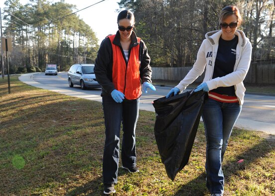 U.S. Air Force Staff Sgt. Rebecca Smith, 23d Force Support Squadron, and Tech. Sgt. Jacqueline Haro, 23d Maintenance Operation Squadron, pick up trash for the Adopt-A-Road program on Gornto Road in Valdosta, Ga., March 9 , 2013. Smith and Haro are with the Moody Air Force Base Air Force Sergeants Association Chapter 460, which recently adopted the road. (U.S. Air Force photo by Senior Airman Eileen Meier/Released)