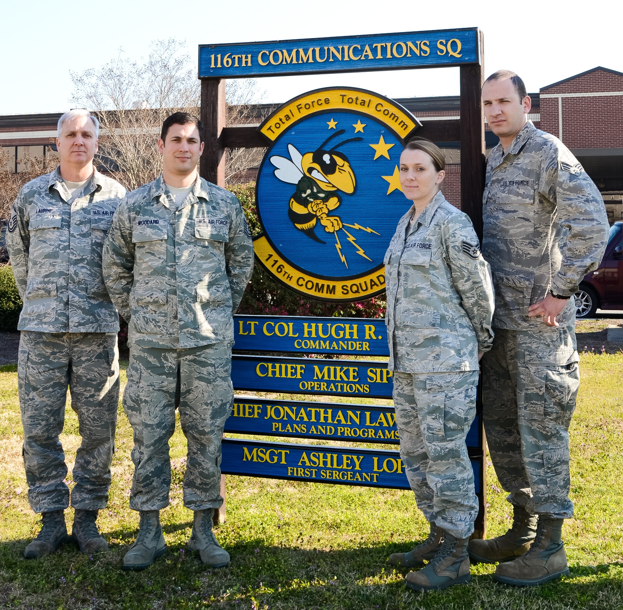 Members of the 116th Air Control Wing's communications squadron who won the Air National Guard Information Dominance and Functional Awards, pose for a group photo in front of their work center at Robins Air Force Base, Ga., March 15, 2013.  The Guardsmen, along with Lt. Col. Hugh Goff, not shown, captured five of 10 national level awards in the Base Communications category.(U.S. Air Force photo by Master Sgt. Roger Parsons/Released)  
