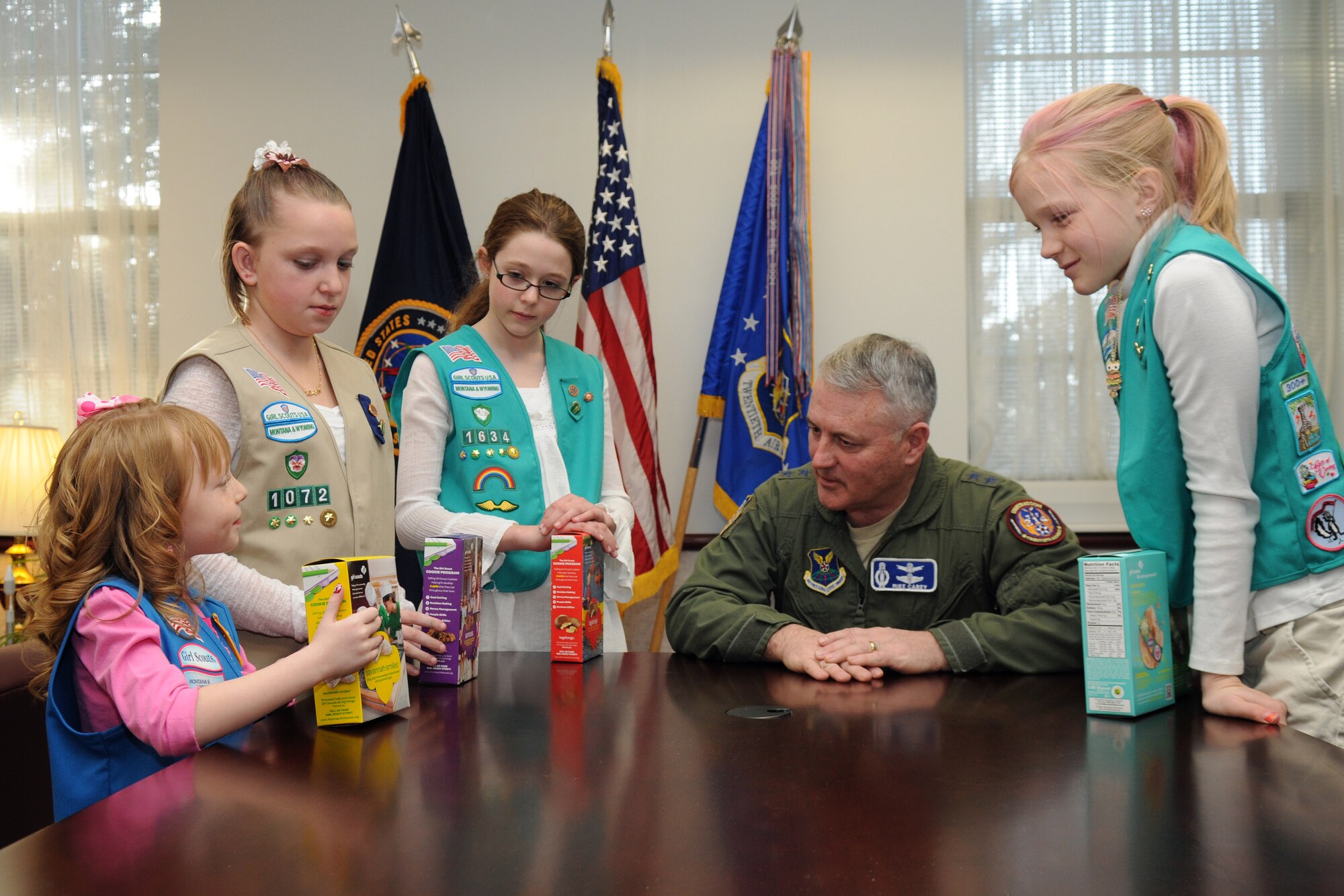 Girl Scouts Kaylee McLean, 5; Hannah Firos, 12; Katelyn House, 10; and Rachel Davis, 9, visit Maj. Gen. Michael Carey, 20th Air Force commander, in his office, March 7, to deliver cookies for the annual Girl Scout Cookie Drive. The girls represented each of the four Girl Scout troops that meet on base, which include girls in kindergarten through eighth grade. For information on joining the Girl Scouts, contact Mary Holscher at 800-736-5243, ext. 2300. (U.S. Air Force photo by R.J. Oriez)