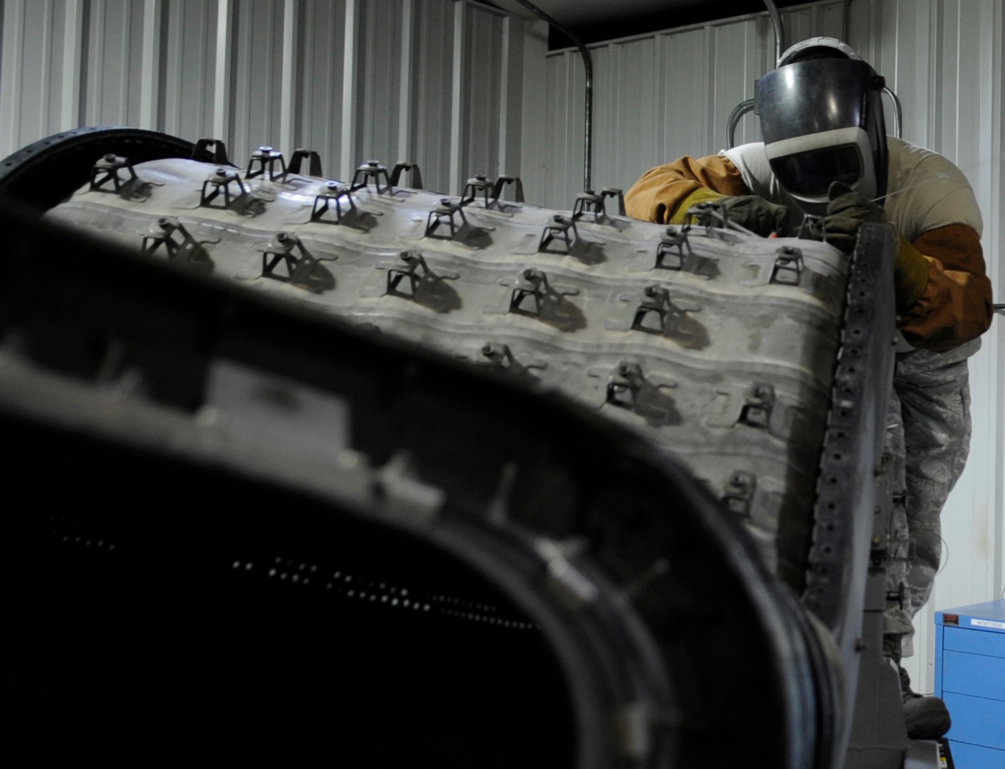 WHITEMAN AIR FORCE BASE, Mo. – U.S. Air Force Tech. Sgt. Jim Gargano, 509th Maintenance Squadron metals technology assistant section chief, welds a connector of a B-2 Spirit Bomber tail pipe liner, Mar. 6. Technicians make use of a wide variety of equipment, including welders, grinders, mills and lathes.  (U.S. Air Force photo/Staff Sgt. Alexandra M. Boutte) (RELEASED)