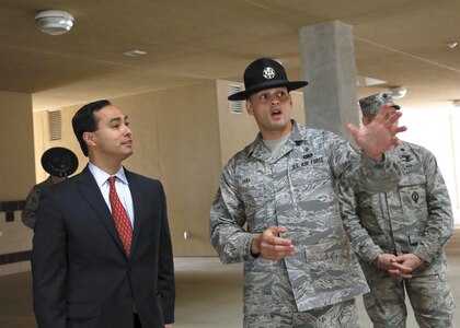 Tech. Sgt Pedro Pena, with the 323rd Training Squadron, gives U.S. Rep. Joaquin Castro a tour of the new basic military training facilities. (U.S. Air Force photo by Robbin Cresswell/Released)
