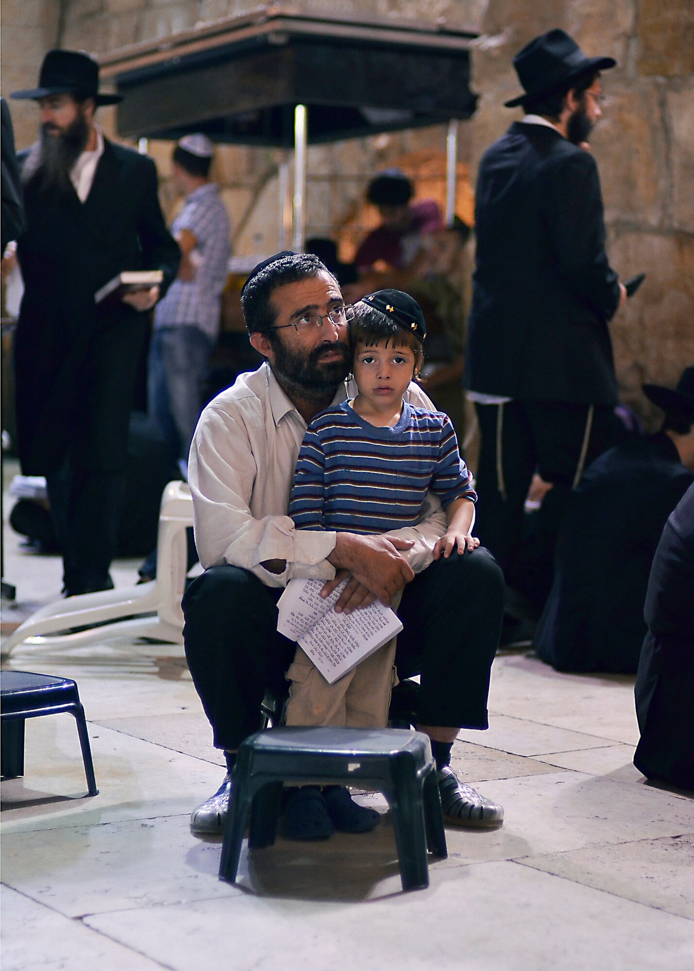 WRIGHT-PATTERSON AIR FORCE BASE, Ohio - A father sings prayers with his little son by the Wailing Wall in Jerusalem, Israel. Staff Sgt. Mikhail Berlin, 445th Airlift Wing photographer, tied for third place in the illustrative photo category, Air Force Reserve Command 2012 Media Contest, with this photograph. (U.S. Air Force photo/Staff Sgt. Mikhail Berlin)