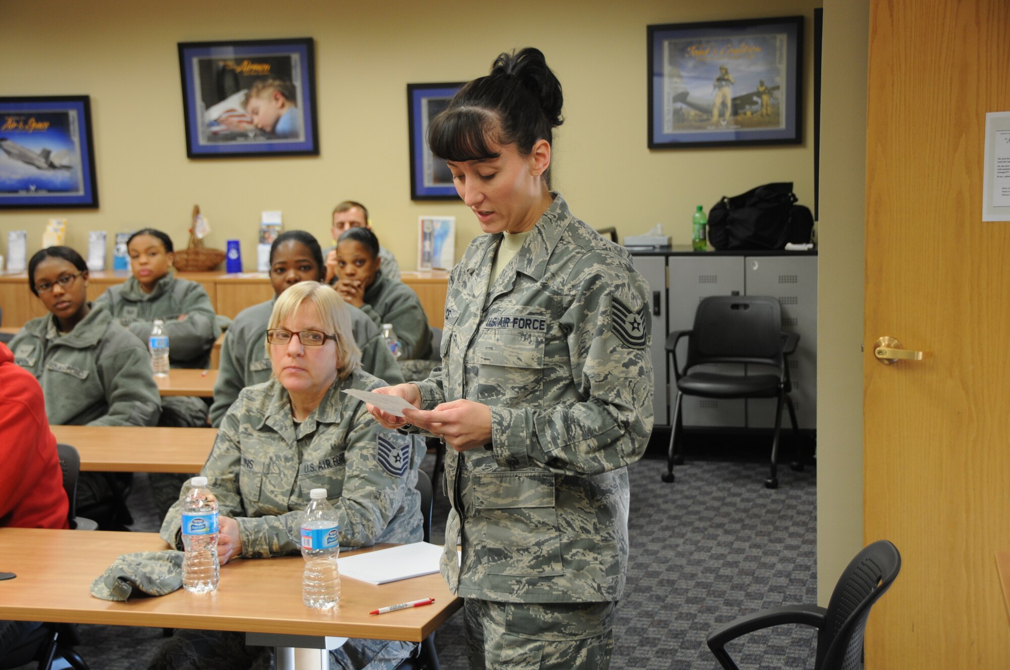 Tech. Sgt. Kristy Price, budget analyst, 192nd Comptroller Flight, asks a proxy question on what it would take for the Virginia Air National Guard to get a designator like North Dakota's "The Happy Hooligans" or South Carolina's "Swamp Foxes", during the first 192nd FW "Ask a Chief" event held February 10, 2013. Airman from the 192nd Fighter Wing participated in the event coordinated by the unit's Junior Enlisted Council. The panel provided an opportunity for airmen ranked E-6 and below to ask questions, receive feedback from the Chiefs and propose ideas that may improve the Va. Air National Guard. Price is also the president of the Junior Enlisted Council and helped coordinate the "Ask a Chief" event.