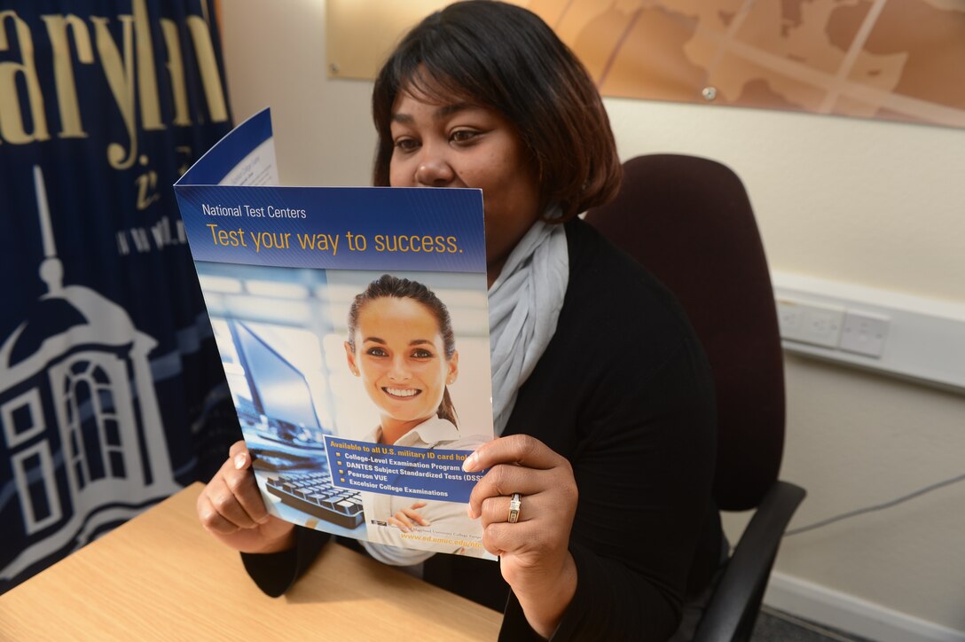 RAF MENWITH HILL, United Kingdom -- LaTosha Gordon-Alexander, University of Maryland University College computer field monitor, reviews testing information for the new National Test Center. The MHS community can now schedule CLEPs and complete the exams on site. For more information, call the education center at 262-7717. (Photo by Staff Sgt. Debbie Lockhart)