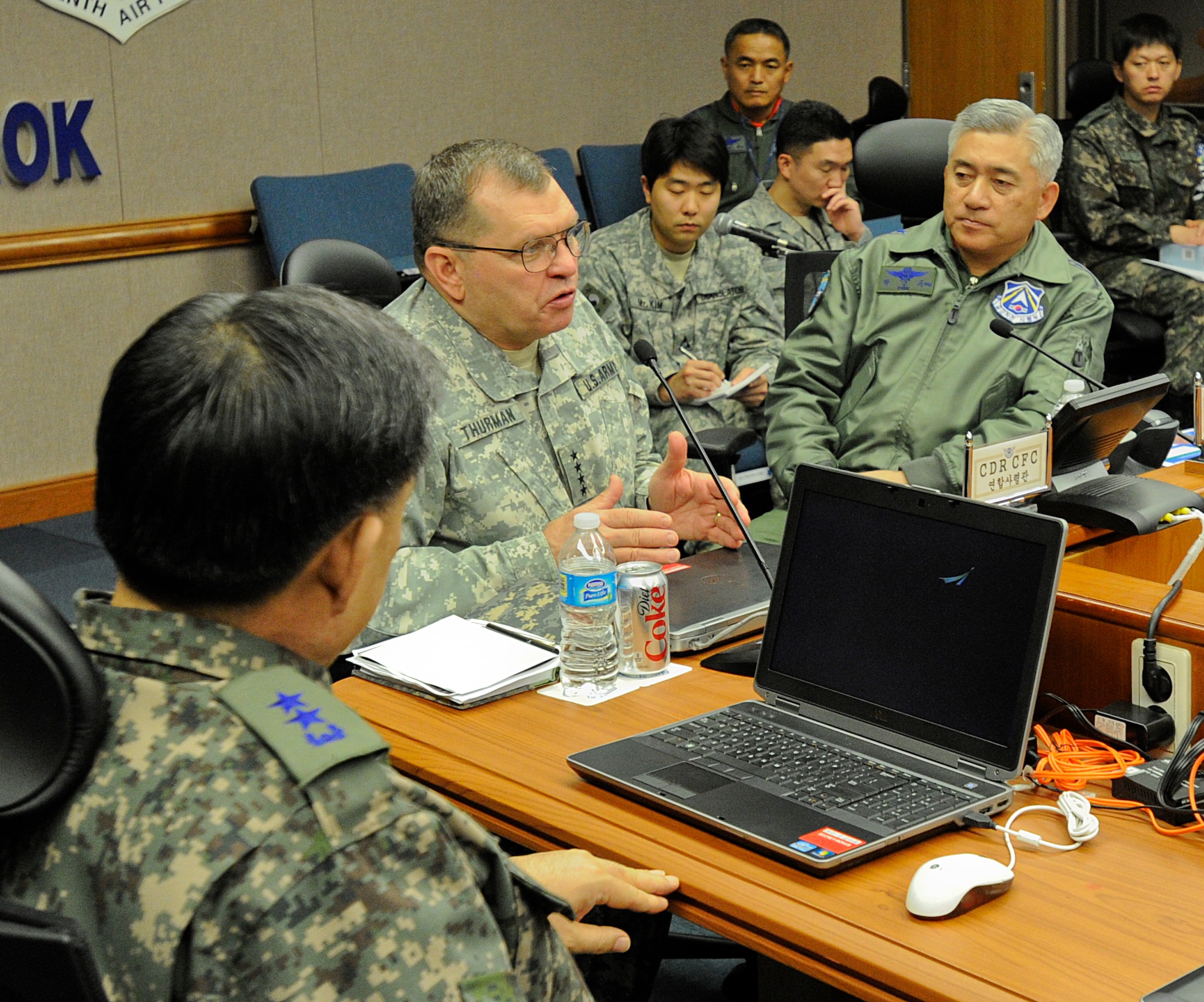 U.S. Army Gen. James D. Thurman, commander of Combined Forces Command, talks to Republic of Korea Air Force Lt. Gen. Park Sin Gyu, Air Force Operations Center commander and other members of ROKAF in a brief during Exercise Key Resolve on Osan Air Base, ROK, March 15, 2013. Exercise Key Resolve is an annual combined and joint command post exercise that is executed under various scenarios with the purpose of honing skills necessary to defend the Republic of Korea. (U.S. Air Force photo/Staff Sgt. Zachary Wolf)