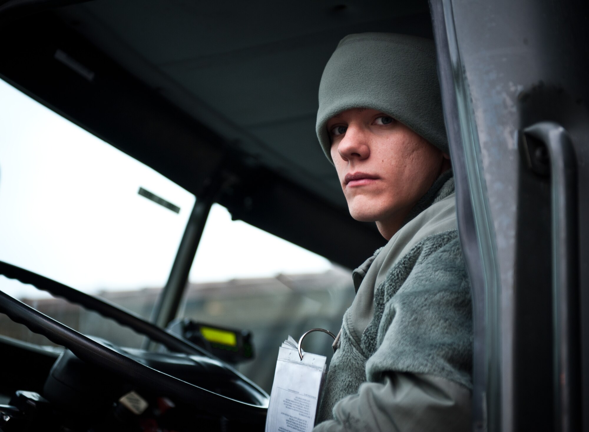 YOKOTA AIR BASE, Japan -- Airman 1st Class Justin Parnell, 374th Logistics Readiness Squadron preventative maintenance technician, pauses while sitting in an R-11 refueling truck during the early hours of March 15, 2013, at Yokota Air Base, Japan. A native of Kentwood, LA, Parnell helps keep planes in the air as they depart from the sole U.S. airlift hub in the western Pacific. (U.S. Air Force photo by 1st Lt. Christopher Love) 