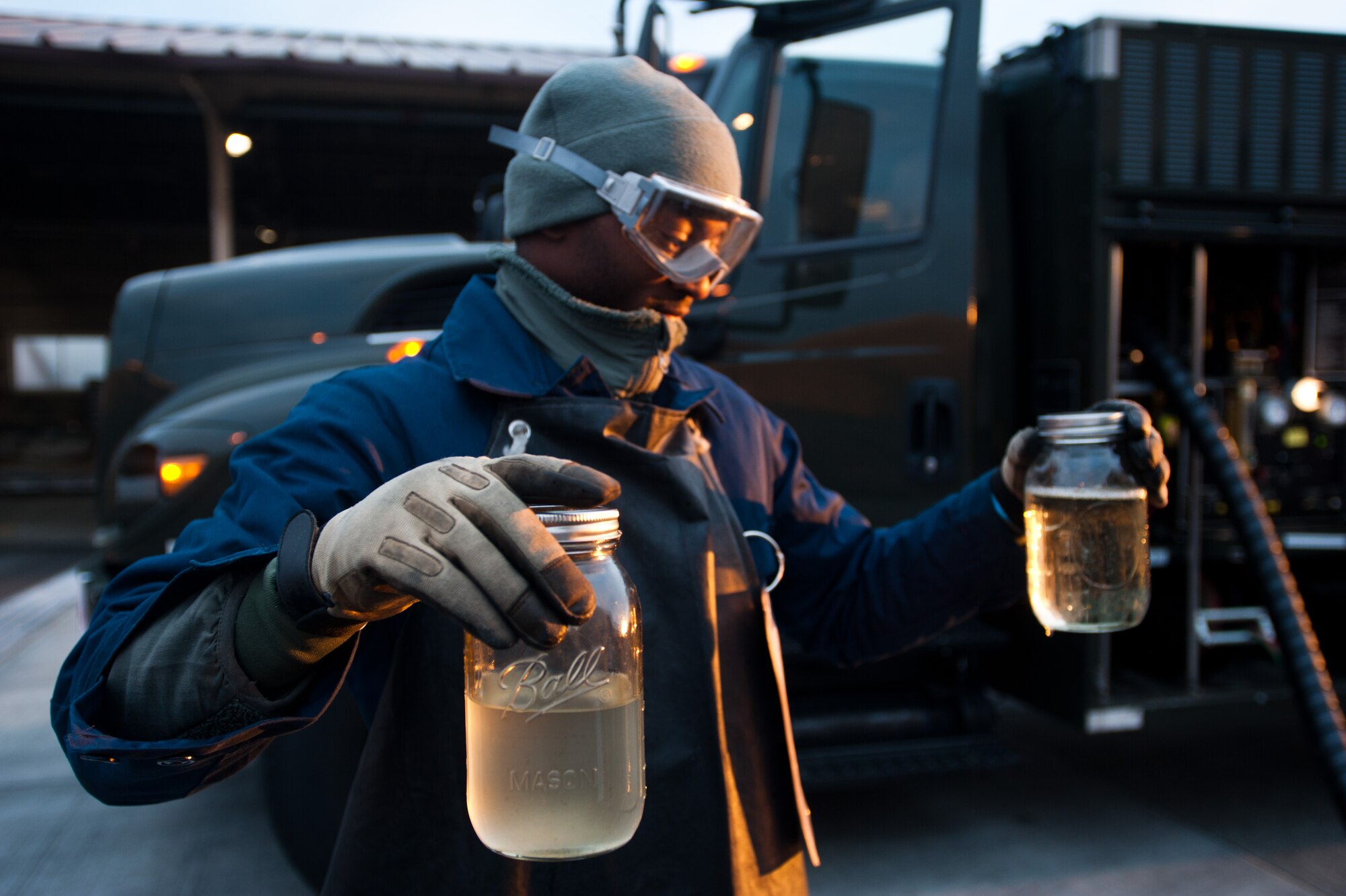 YOKOTA AIR BASE, Japan -- Airman 1st Class Alec Emerson, 374th Logistics Readiness Squadron preventative maintenance technician and a Hampton, VA native, assesses the quality of a fuel sample taken from an R-11 refueling truck at Yokota Air Base, Japan, March 15, 2013. Tests like these help Yokota's fuel team ensure clean fuel reaches aircraft. (U.S. Air Force photo by 1st Lt. Christopher Love) 