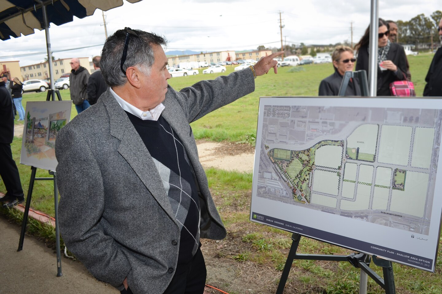 Stan Wallin of the U.S. Army Corps of Engineers Sacramento District's real estate office, points to where a new access control point will be constructed at U.S. Army Garrison Camp Parks Reserve Training center in Dublin, Calif., March 6, 2013. The district's real estate office is overseeing a 180-acre transfer of land in exchange for an estimated $66 million in modern facilities for Camp Parks over the next several years. Wallin and other representatives from the district attended a groundbreaking ceremony commemorating the first of six phases of construction, which is the largest Army Reserve real property exchange agreement in Department of Defense history.