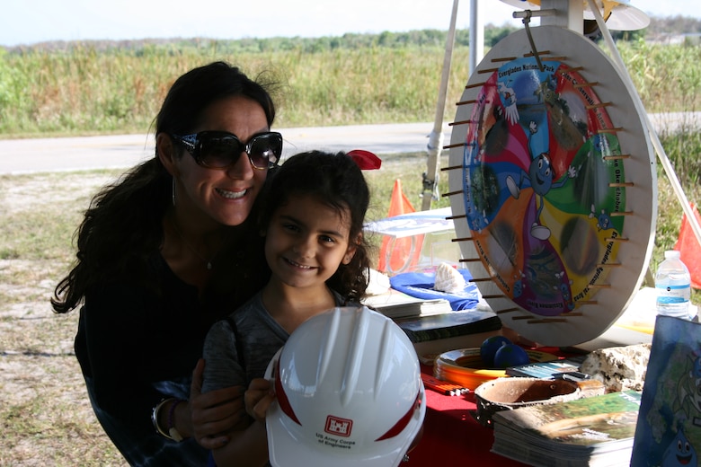Everglades Day at the Arthur R. Marshall Loxahatchee National Wildlife Refuge brings many families and children like Sara Green to the Corps booth, where they spin the “Wayne Drop” wheel and learn about the Everglades and water safety. 
