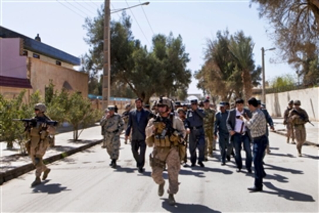 U.S. Marines provide security while escorting local leaders and Afghan military members to a meeting in Nimroz province, Afghanistan, March 13, 2013. 