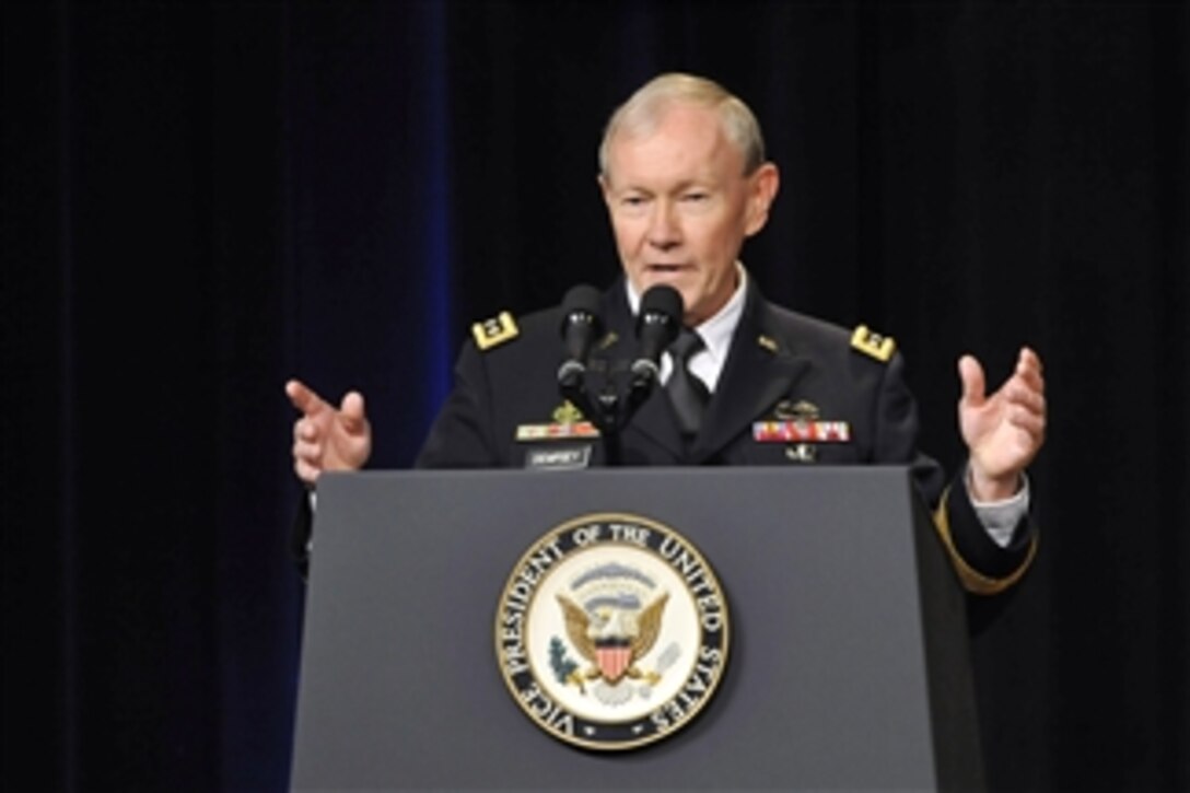 Chairman of the Joint Chiefs of Staff Army Gen. Martin E. Dempsey addresses the audience at the welcoming ceremony for Secretary of Defense Chuck Hagel in the Pentagon on March 14, 2013.  