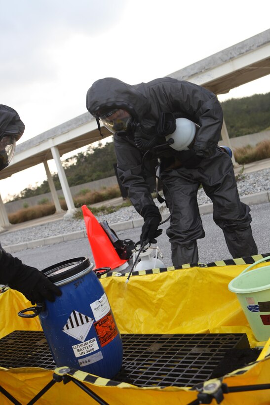 Chemical, Biological, Radiological and Nuclear defense specialists with the Marine Air Ground Task Force Assessment and Consequence Management Team of the 31st Marine Expeditionary Unit decontaminate the outside of a chemical container and prepare it for safe transport a foreign village warehouse here, March 14. The CBRN operation was in response to the confirmed presence of a chemical weapon-making facility during a notional humanitarian aid and disaster relief operation. The MAGTF ACMT evacuated casualties, inspected the premises and removed all chemical materials found. The 31st MEU’s CERTEX is a semiannual exercise where Special Operations Training Group, III Marine Expeditionary Force, evaluates the unit’s full range of capabilities, with the purpose of maintaining the MEU’s proficiency and readiness. The 31st MEU is the only continuously forward-deployed MEU and is the Marine Corps’ force in readiness in the Asia-Pacific region.