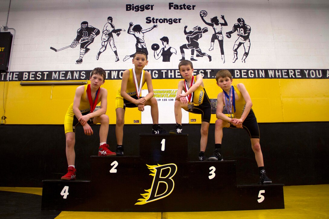 Four members of the Burnsville Sparks Wrestling Program concluded their regular season last week by qualifying for the 2013 USA Wrestling Youth Minnesota State Championships. The wrestlers include Jordan Scott, 11, Jude De La Luz, 8, Isaac Gawronski, 8, and Gavin Osterhaus, 11. Recruiting Station Twin Cities Commanding Officer Maj. Kenneth Gawronski and Officer Selection Station Twin Cities' Gunnery Sgt. Roland McGinnis volunteered to help coach the wrestling club this season.