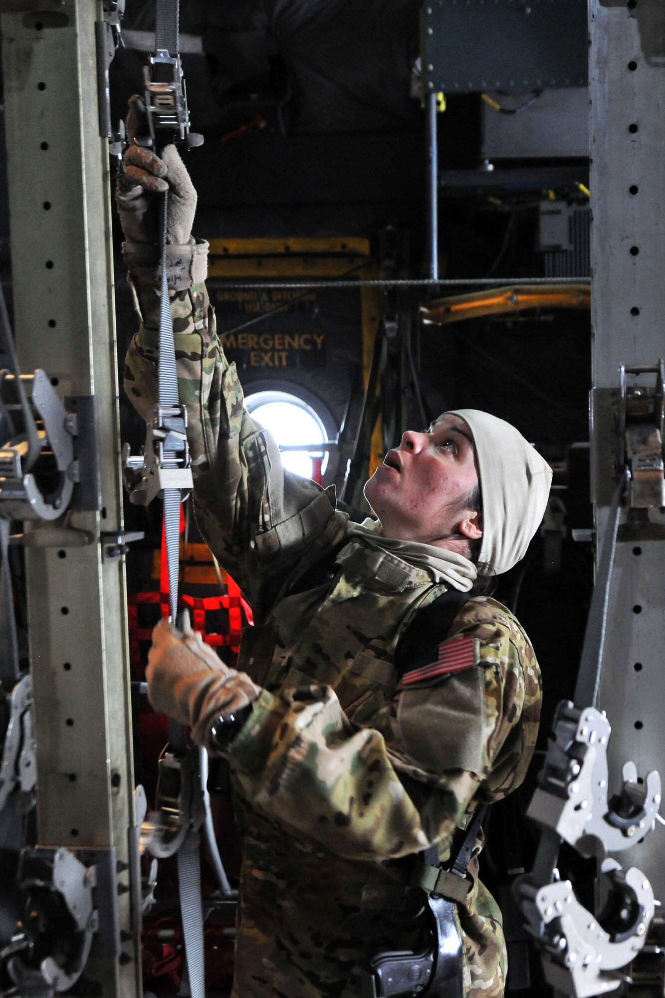 Master Sgt.  Jennifer Higgs, 455th Expeditionary Aeromedical Evacuation Squadron technician, conducts an equipment function check inside a C-130 Hercules on Bagram Airfield, Afghanistan, Feb. 21, 2013.  The 455th EAES perform their missions on fixed wing aircraft, including the C-17 Globemaster III, C-130 Hercules and KC-135 Stratotanker, and can provide extensive critical care capability with the Critical Care Air Transport Teams. (U.S. Air Force photo/Senior Airman Chris Willis)