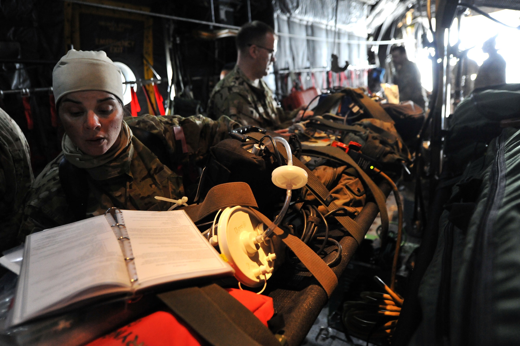 Master Sgt.  Jennifer Higgs, 455th Expeditionary Aeromedical Evacuation Squadron technician, conducts an equipment function check inside a C-130 Hercules on Bagram Airfield, Afghanistan, Feb. 21, 2013.  The 455th EAES perform their missions on fixed wing aircraft, including the C-17 Globemaster III, C-130 Hercules and KC-135 Stratotanker, and can provide extensive critical care capability with the Critical Care Air Transport Teams. (U.S. Air Force photo/Senior Airman Chris Willis)