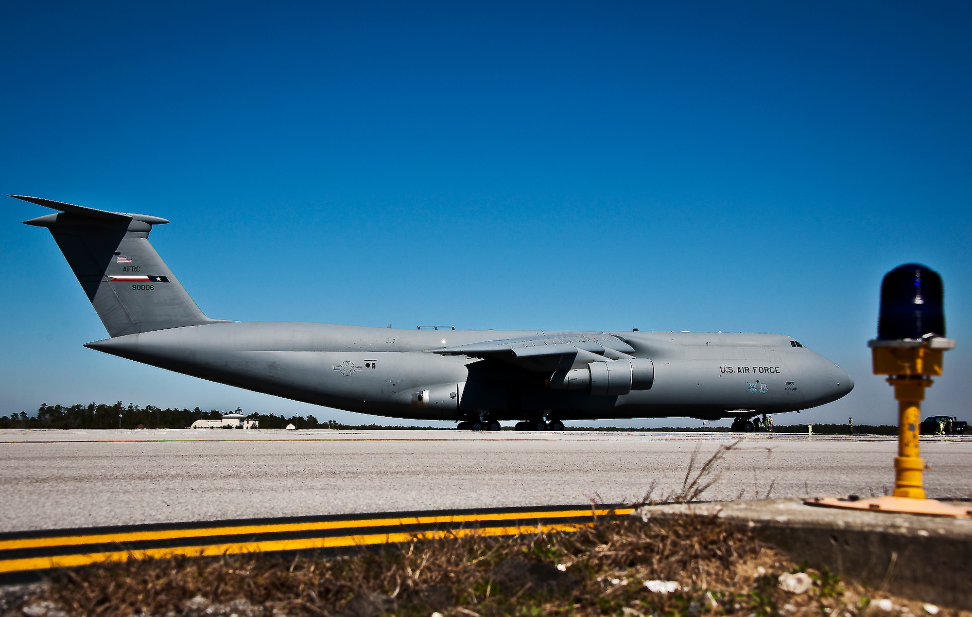 A C-5 Galaxy from the 433rd Airlift Wing arrived at Eglin Air Force Base, Fla., March 14.  The reserve wing’s aircraft brought maintenance equipment from the 482nd Fighter Wing to the base in preparation for the weapons system evaluation program taking place March 18-22.  (U.S. Air Force photo/Samuel King Jr.)