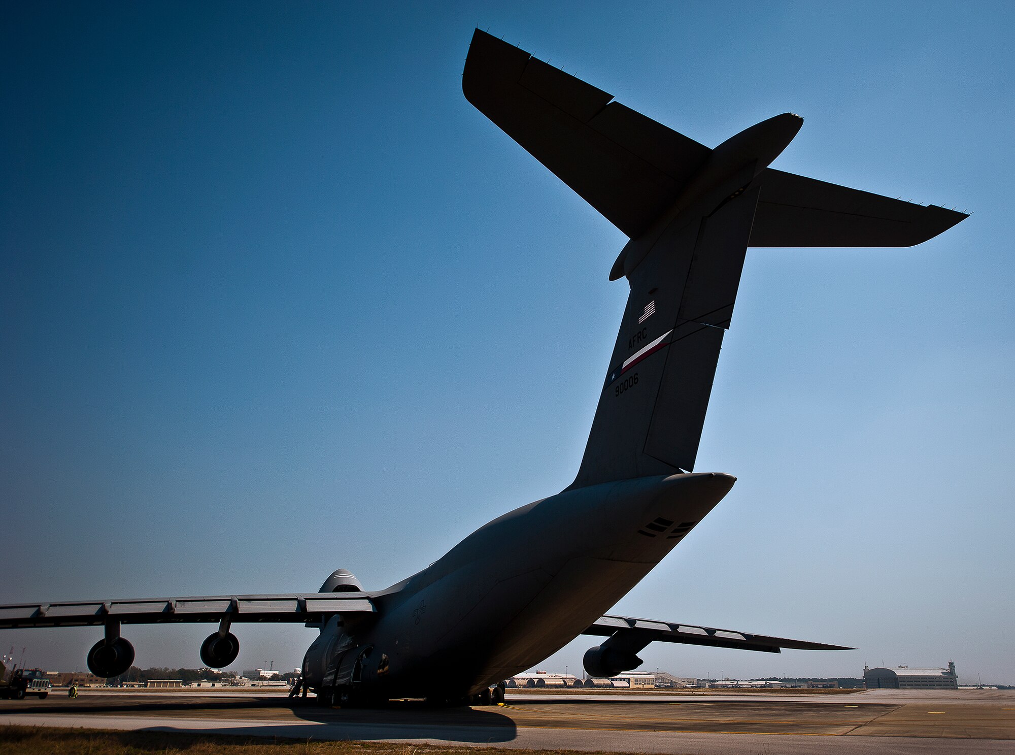 The tail of a 433rd Airlift Wing C-5 Galaxy reaches toward the sky at Eglin Air Force Base, Fla., March 14.  The reserve wing’s aircraft brought maintenance equipment from the 482nd Fighter Wing to the base in preparation for the weapons system evaluation program taking place March 18-22.  (U.S. Air Force photo/Samuel King Jr.)