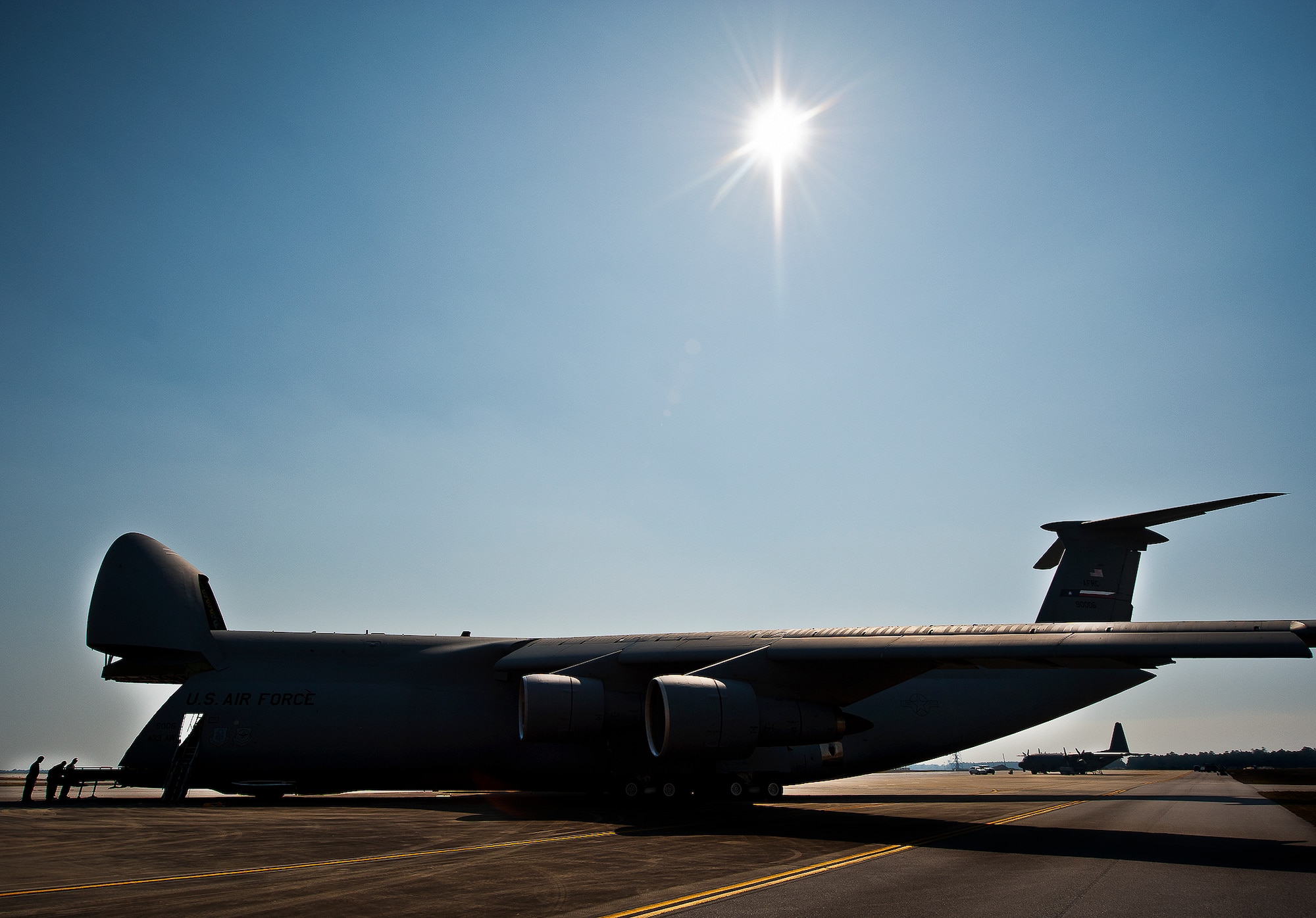 The C-5 Galaxy aircrew, from the 433rd Airlift Wing, completes post-flight checks on the flightline at Eglin Air Force Base, Fla., March 14.  The reserve wing’s aircraft brought maintenance equipment from the 482nd Fighter Wing to the base in preparation for the weapons system evaluation program taking place March 18-22.  (U.S. Air Force photo/Samuel King Jr.)