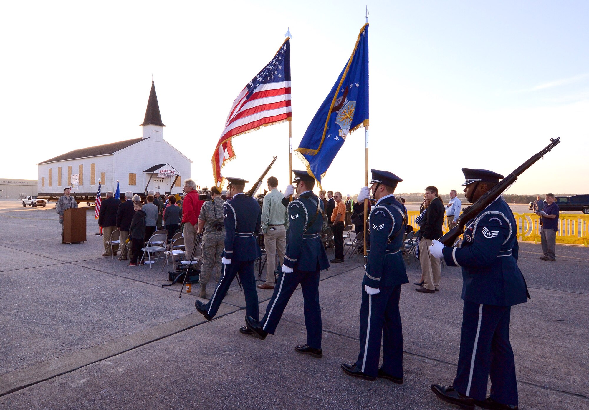 Members of the Dobbins Air Reserve Base Honor Guard bring the colors forward at an early morning ceremony marking the relocation of the Dobbins chapel, Dobbins ARB, Ga., March. 17. To meet post-9/11 security requirements, new construction of a perimeter road and parking lot at the chapel site dictated the chapel must be removed.  The private, non-profit Dobbins Chapel Foundation, 94th Airlift Wing and Georgia National Guard arrived at a solution at no cost to the government, to move the historic chapel across the base. (U.S. Air Force photo/Brad Fallin)