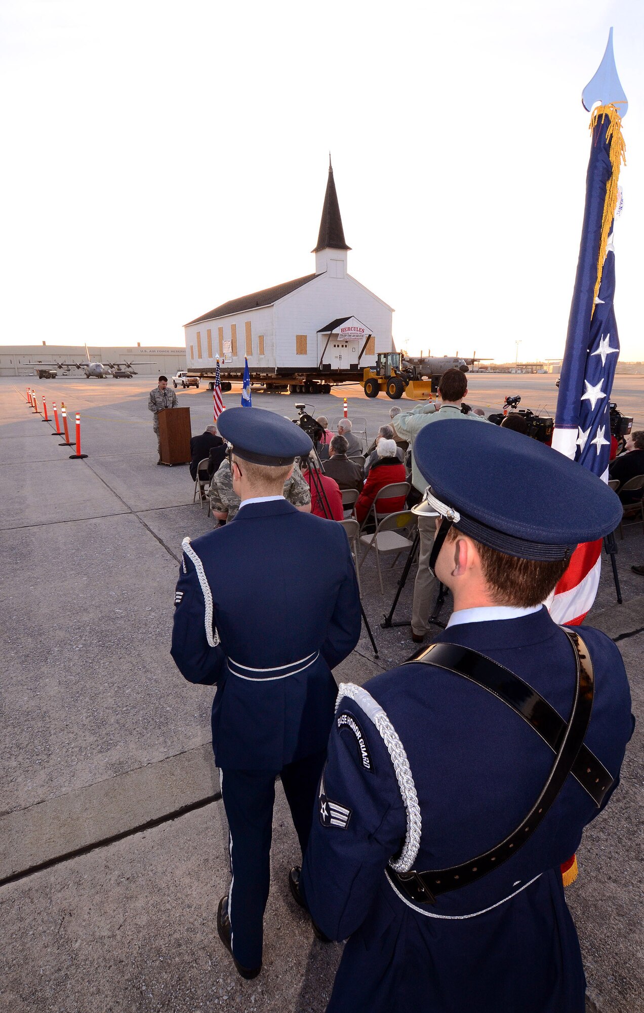 Members of the Dobbins Air Reserve Base Honor Guard stand by to present the colors at an early morning ceremony marking the relocation of the Dobbins chapel, Dobbins ARB, Ga., March. 17. To meet post-9/11 security requirements, new construction of a perimeter road and parking lot at the chapel site dictated the chapel must be removed.  The private, non-profit Dobbins Chapel Foundation, 94th Airlift Wing and Georgia National Guard arrived at a solution at no cost to the government, to move the historic chapel across the base. (U.S. Air Force photo/Brad Fallin)