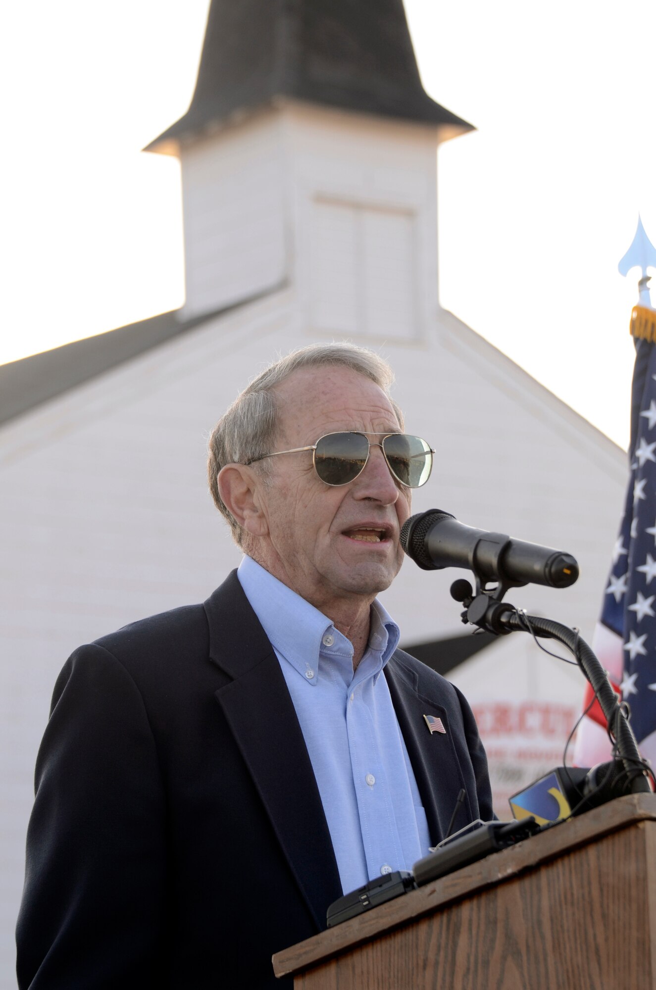 Retired Col. John Powers, Dobbins Chapel Foundation chairman, speaks at a ceremony commemorating the relocation of the Dobbins Air Reserve Base chapel held prior to the structures move across the runway and to Clay Army National Guard Camp, Ga., March 17. Dobbins has been home to the chapel for over 60 years and has played a large role in member’s lives both past and present. (U.S. Air Force photo/Don Peek)