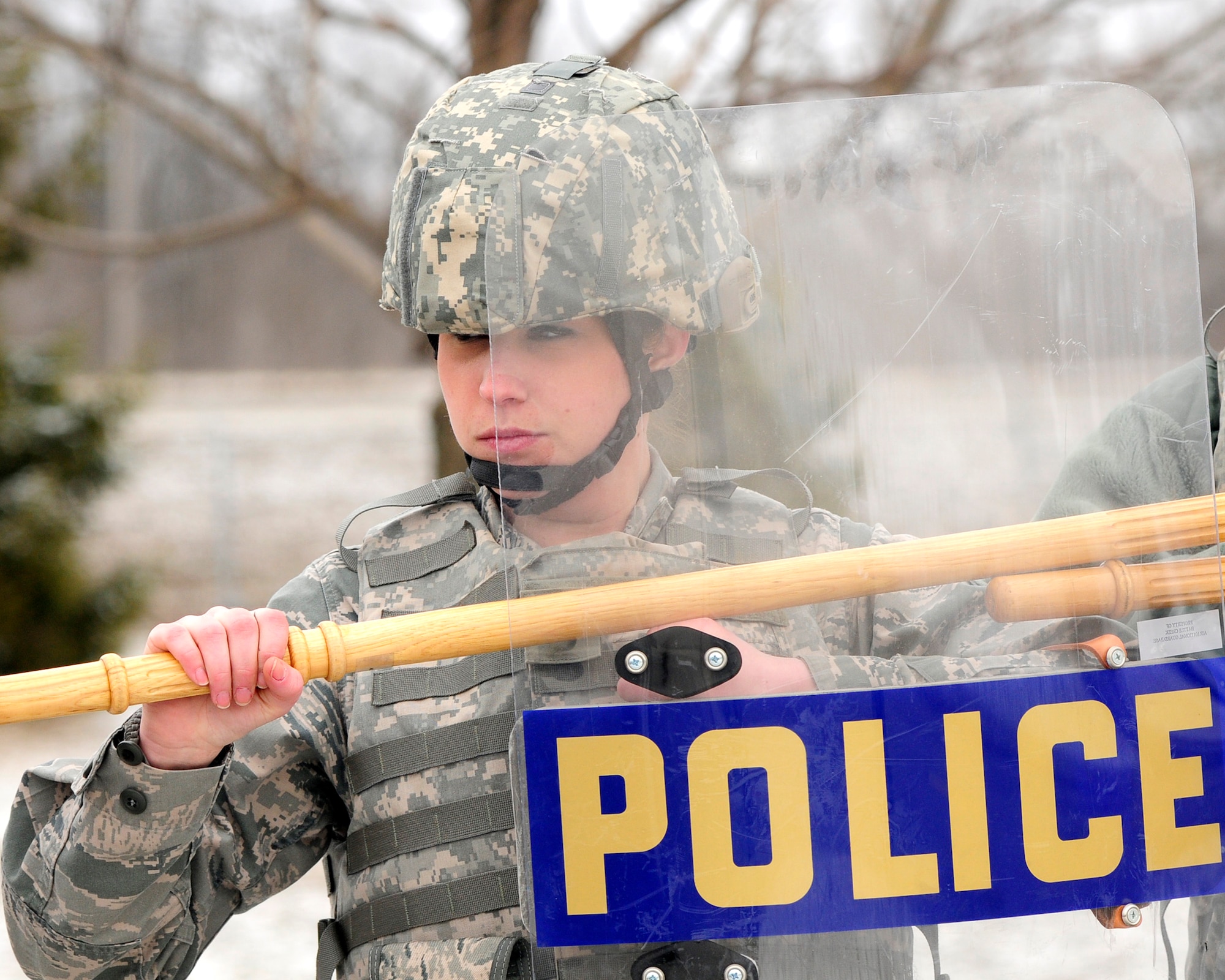 Airmen from the 110th Airlift Wing Security Forces Squadron conduct civil disturbance training at the Battle Creek Air National Guard Base, Battle Creek, Mich., March 16, 2013. Security Force members train in a variety of Air Base ground defense tactics to better respond to worldwide contingencies and protect Air Force resources. (U.S. Air Force photo by Tech. Sgt. David Eichaker/released)