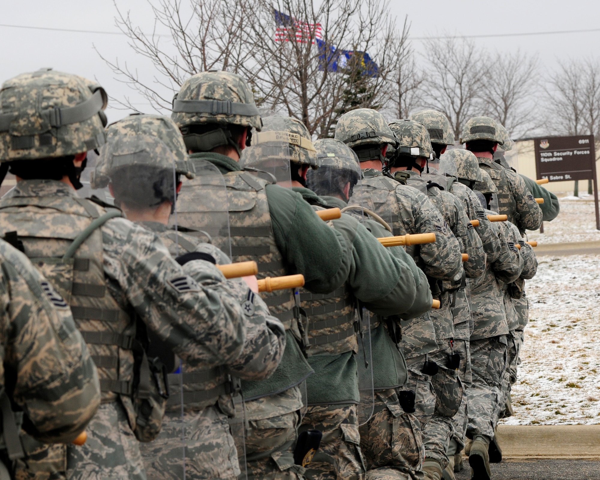 Airmen from the 110th Airlift Wing Security Forces Squadron conduct civil disturbance training at the Battle Creek Air National Guard Base, Battle Creek, Mich., March 16, 2013. Security Force members train in a variety of Air Base ground defense tactics to better respond to worldwide contingencies and protect Air Force resources. (U.S. Air Force photo by Tech. Sgt. David Eichaker/released)