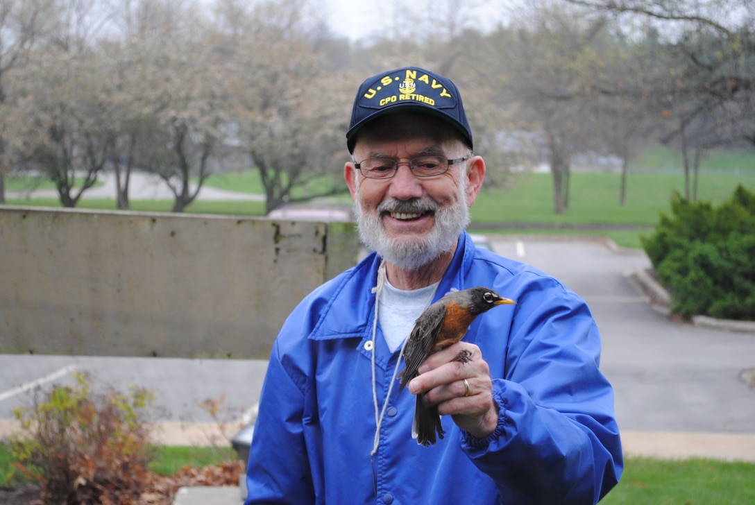 Licensed Bird Bander Nelson Hoskins with American Robin