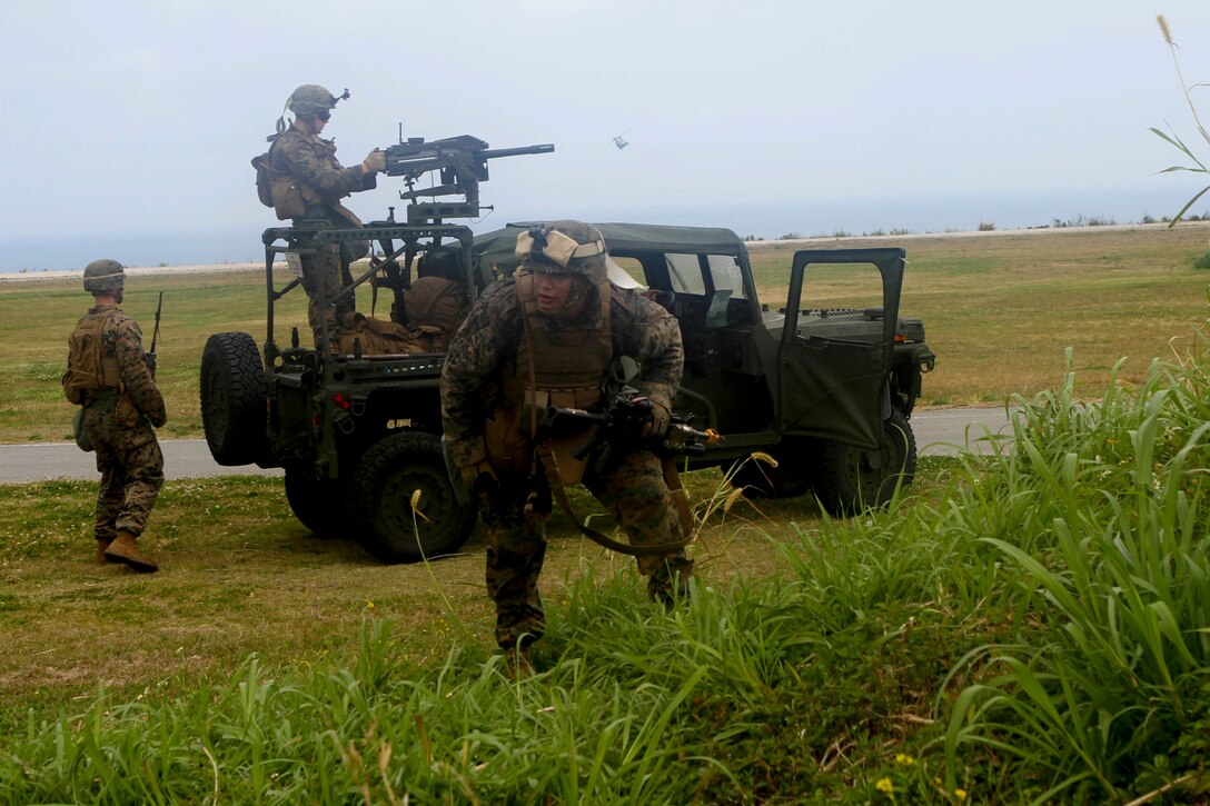 Marines with Company C., Battalion Landing Team 1st Battalion, 5th Marines, 31st Marine Expeditionary Unit, attack enemy role players during a helicopter assault here, March 13. The 31st MEU’s “Helo Company” conducted the attack at an airfield with a small collection of structures defended by more than a dozen role players. The scenario was part of the 31st MEU’s Certification Exercise, prepared and evaluated by Special Operations Training Group, III Marine Expeditionary Force. The 31st MEU is the only continuously forward-deployed MEU and is the Marine Corps’ force in readiness in the Asia-Pacific region.