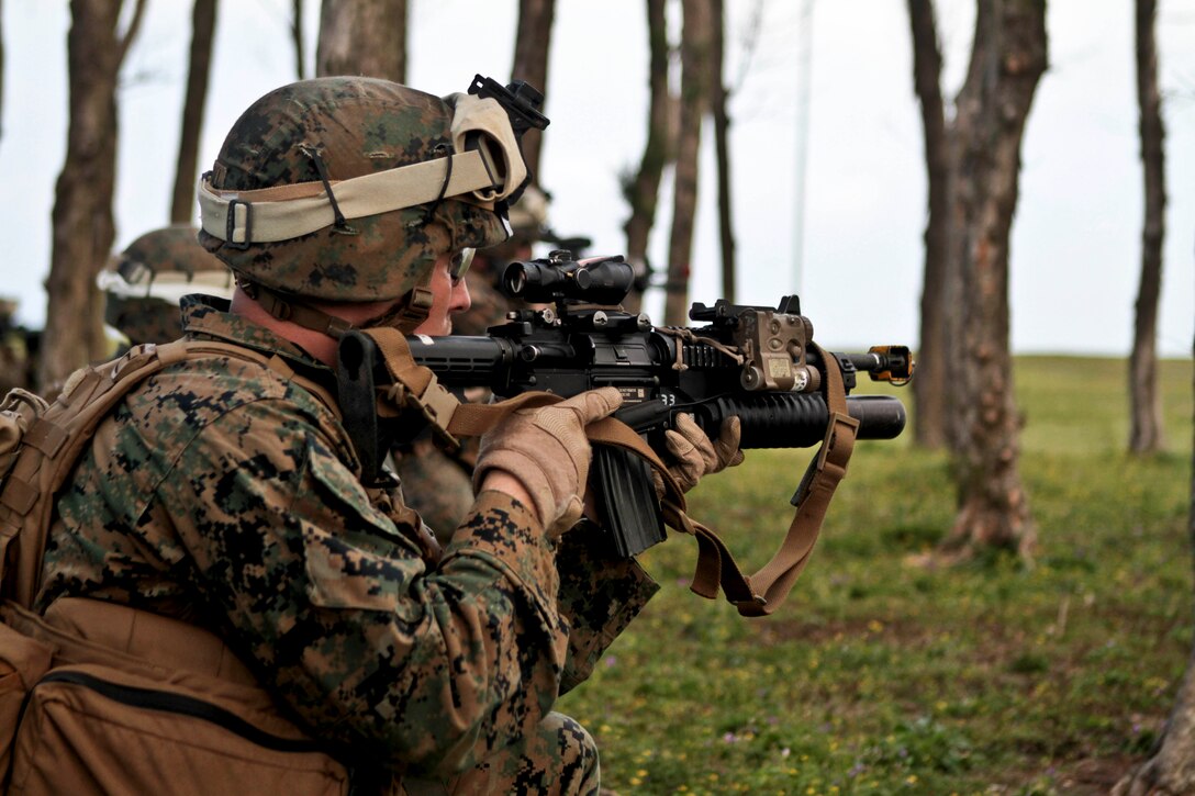 Lance Cpl. Nicholas S. Thorpe, a rifleman with Company C., Battalion Landing Team 1st Battalion, 5th Marines, 31st Marine Expeditionary Unit, and a native of Minneapolis, Minn., attacks enemy role players during a helicopter assault here, March 13. The 31st MEU’s “Helo Company” conducted the attack at an airfield with a small collection of structures defended by more than a dozen role players. The scenario was part of the 31st MEU’s Certification Exercise, prepared and evaluated by Special Operations Training Group, III Marine Expeditionary Force. The 31st MEU is the only continuously forward-deployed MEU and is the Marine Corps’ force in readiness in the Asia-Pacific region.
