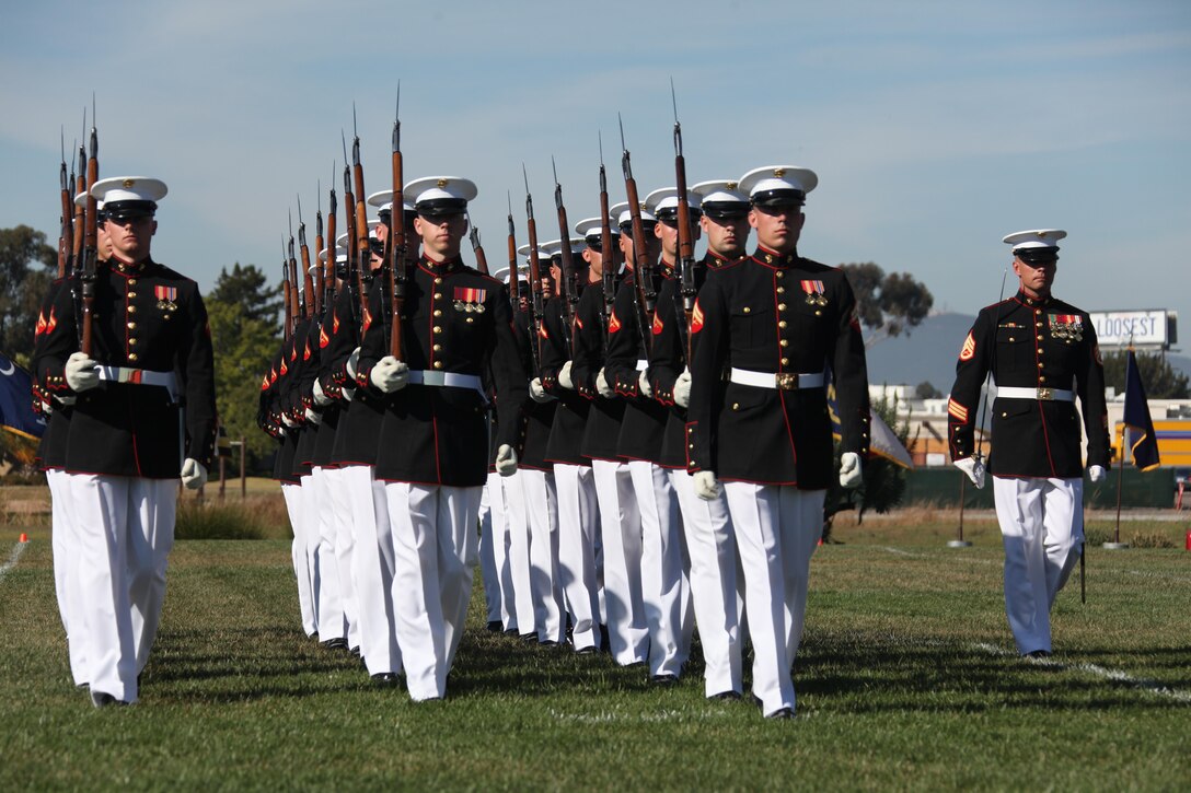 Marines with the Silent Drill Platoon perform during a Battle Colors Ceremony aboard Marine Corps Air Station Miramar, Calif., March 14. With a reputation of perfection throughout the world, the silent drill platoon reminds onlookers of the proud esprit de Corps found in Marines serving all around the globe.